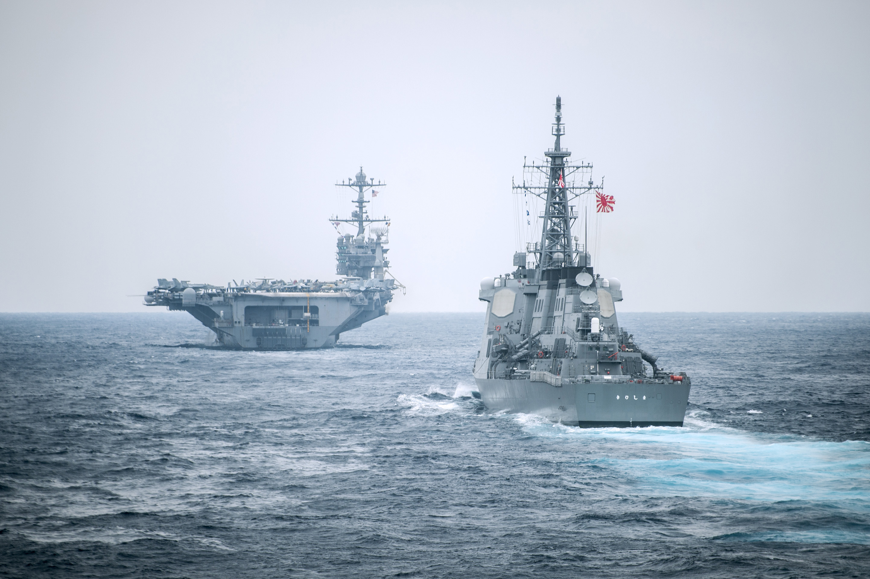 USS George Washington (CVN-73) with the Japan Maritime Self-Defense Force Kongou-class guided-missile destroyer JS Kirishima (DDG-174) on Nov. 18, 2014. US Navy Photo