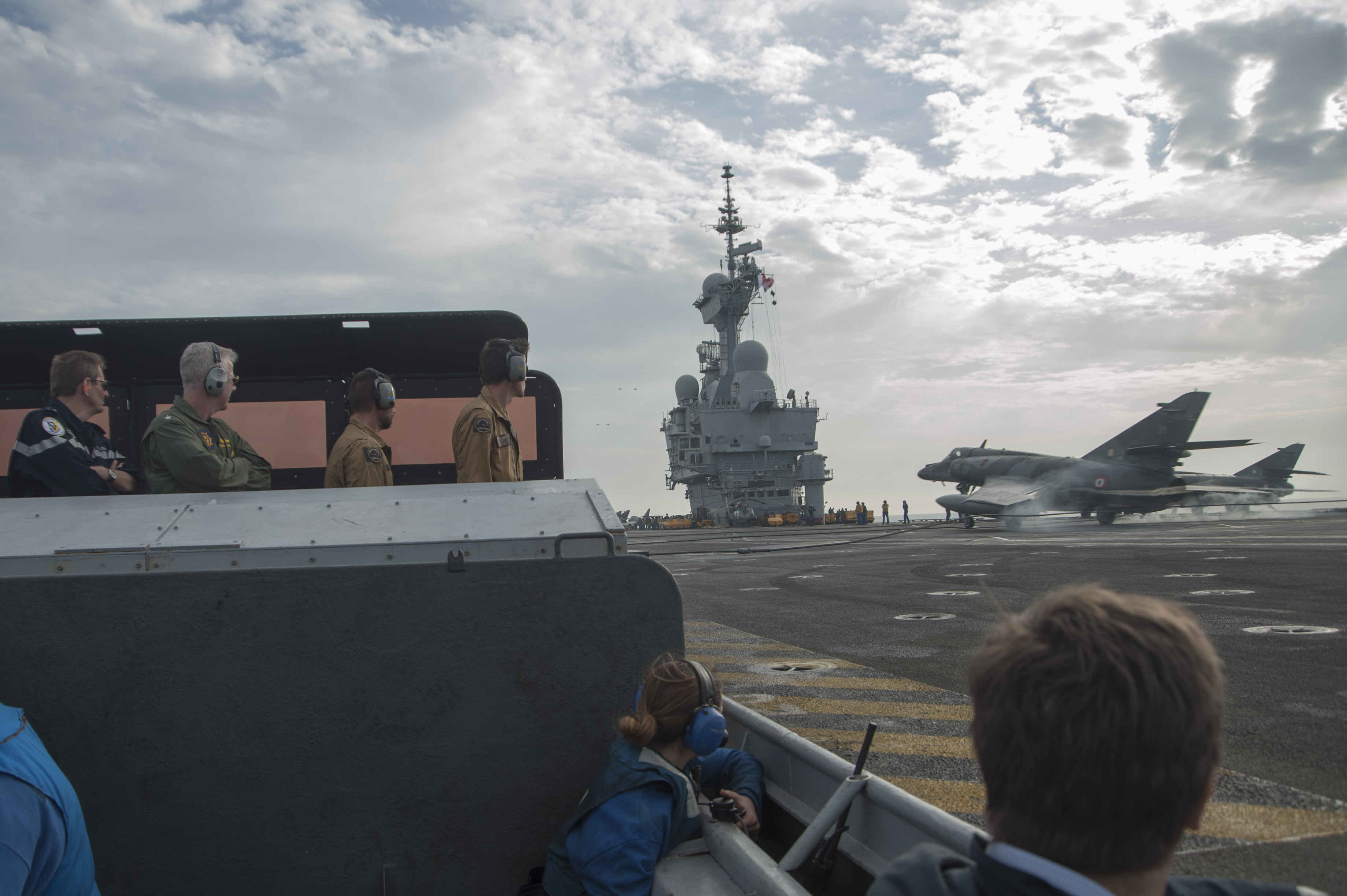 Rear Adm. Eric Chaperon, commander, French Navy Task Force 473, left, and Rear Adm. Kevin Sweeney, Commander, Harry S. Truman Carrier Strike Group 10on the flight deck of the French aircraft carrier Charles de Gaulle (R9) in 2014. US Navy Photo