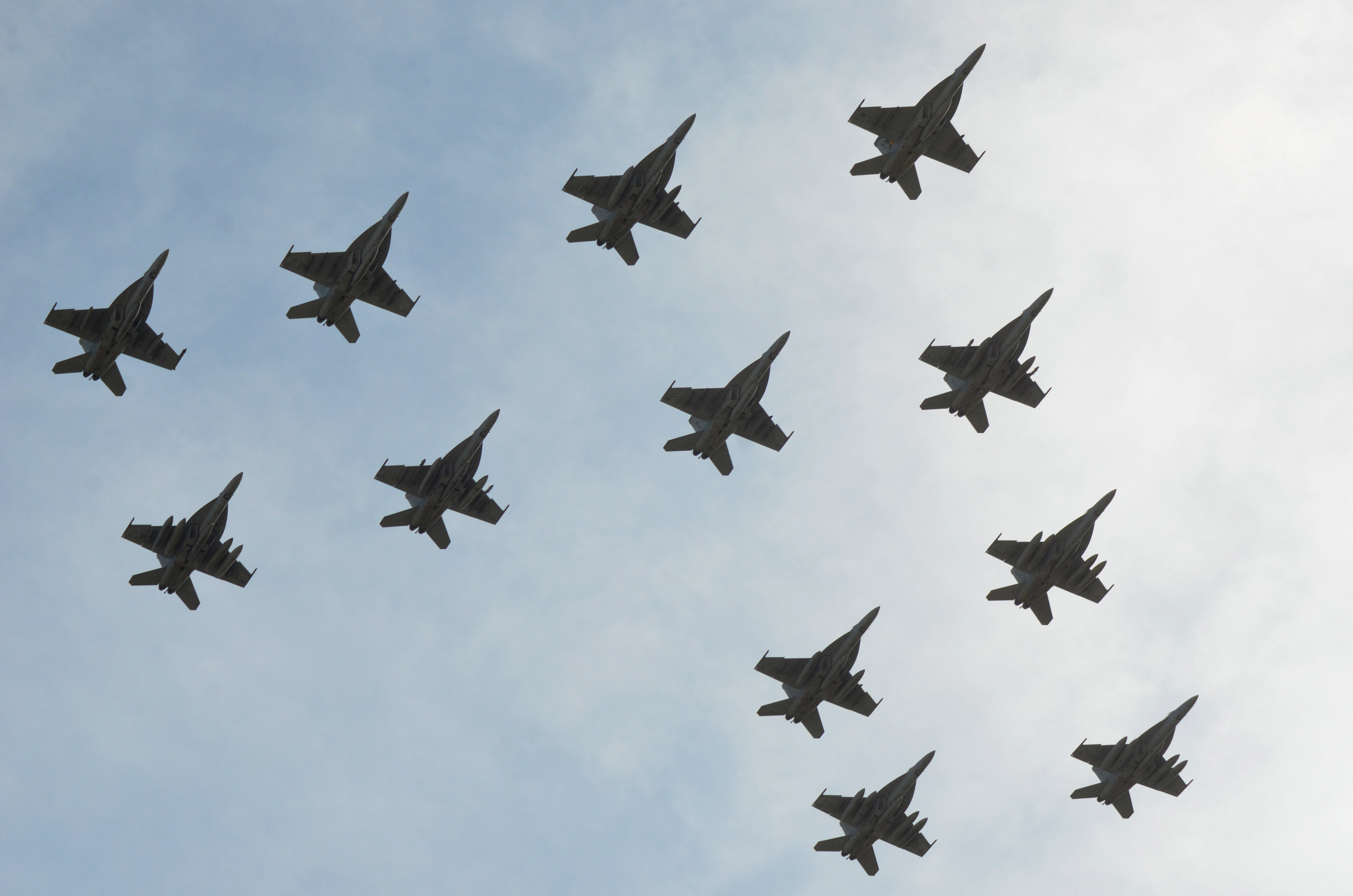 The "Gunslingers" of Strike Fighter Squadron (VFA) 105 conduct a flyover during their homecoming at Naval Air Station Oceana, Va. on April 17, 2014. US Navy Photo
