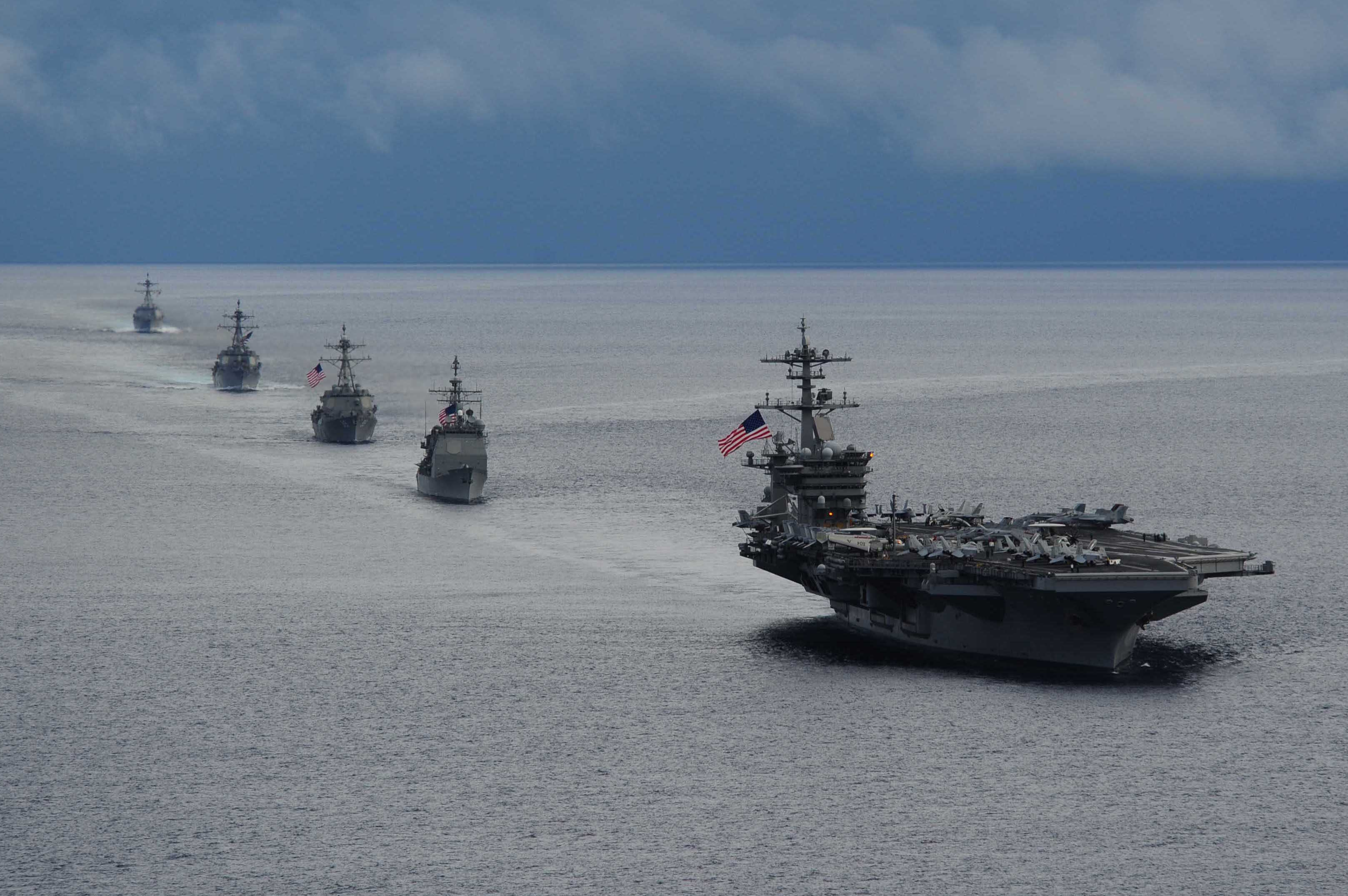 USS Theodore Roosevelt (CVN 71) leads a formation of ships from Carrier Strike Group (CSG) 12 during a maneuvering exercise on Sept. 23, 2014. US Navy Photo 