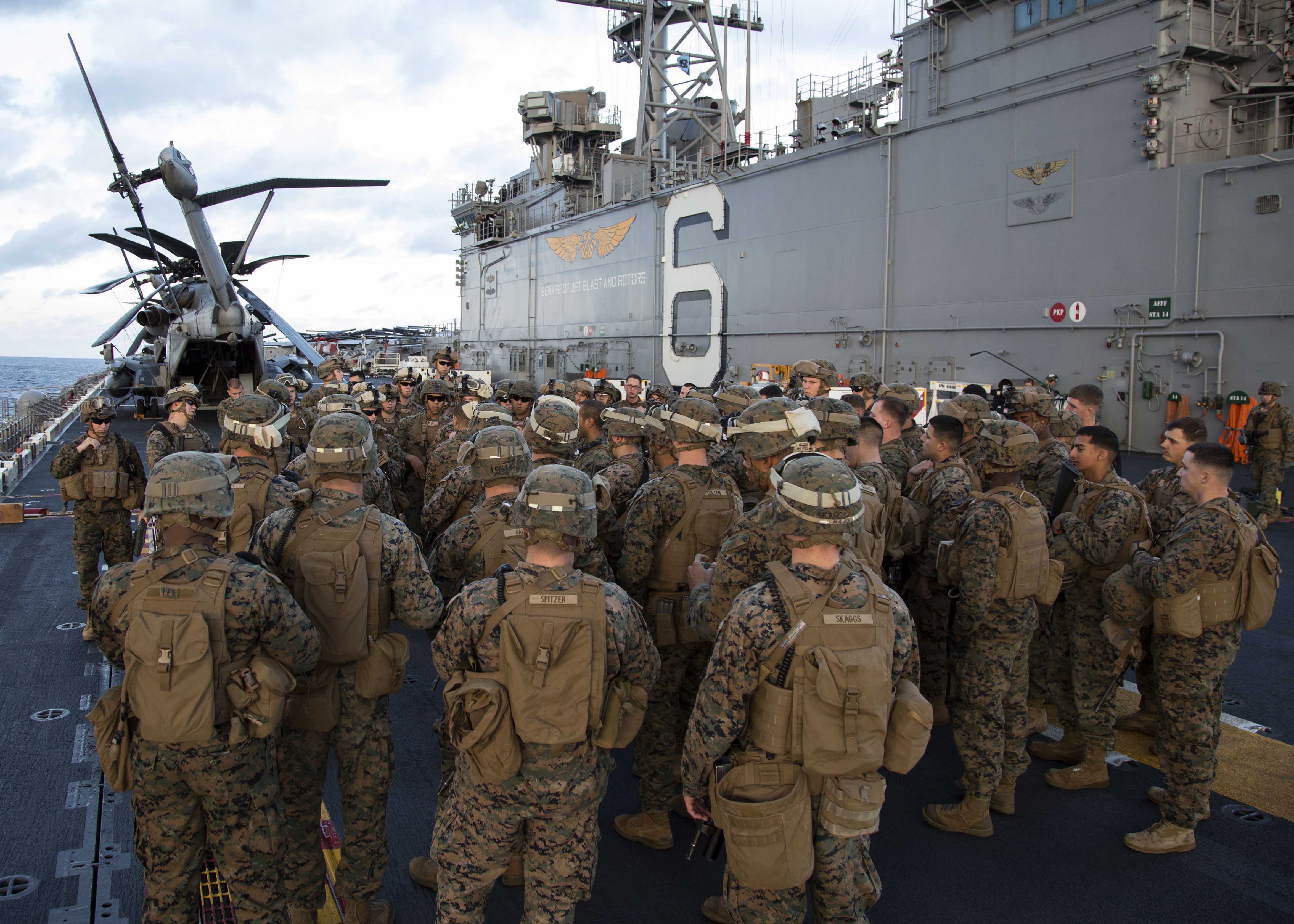 Marines assigned to the 31st Marine Expeditionary Unit (31st MEU) prepare for a live-fire exercise on the flight deck of the amphibious assault ship USS Bonhomme Richard (LHD-6) on Feb. 10, 2015. US Navy