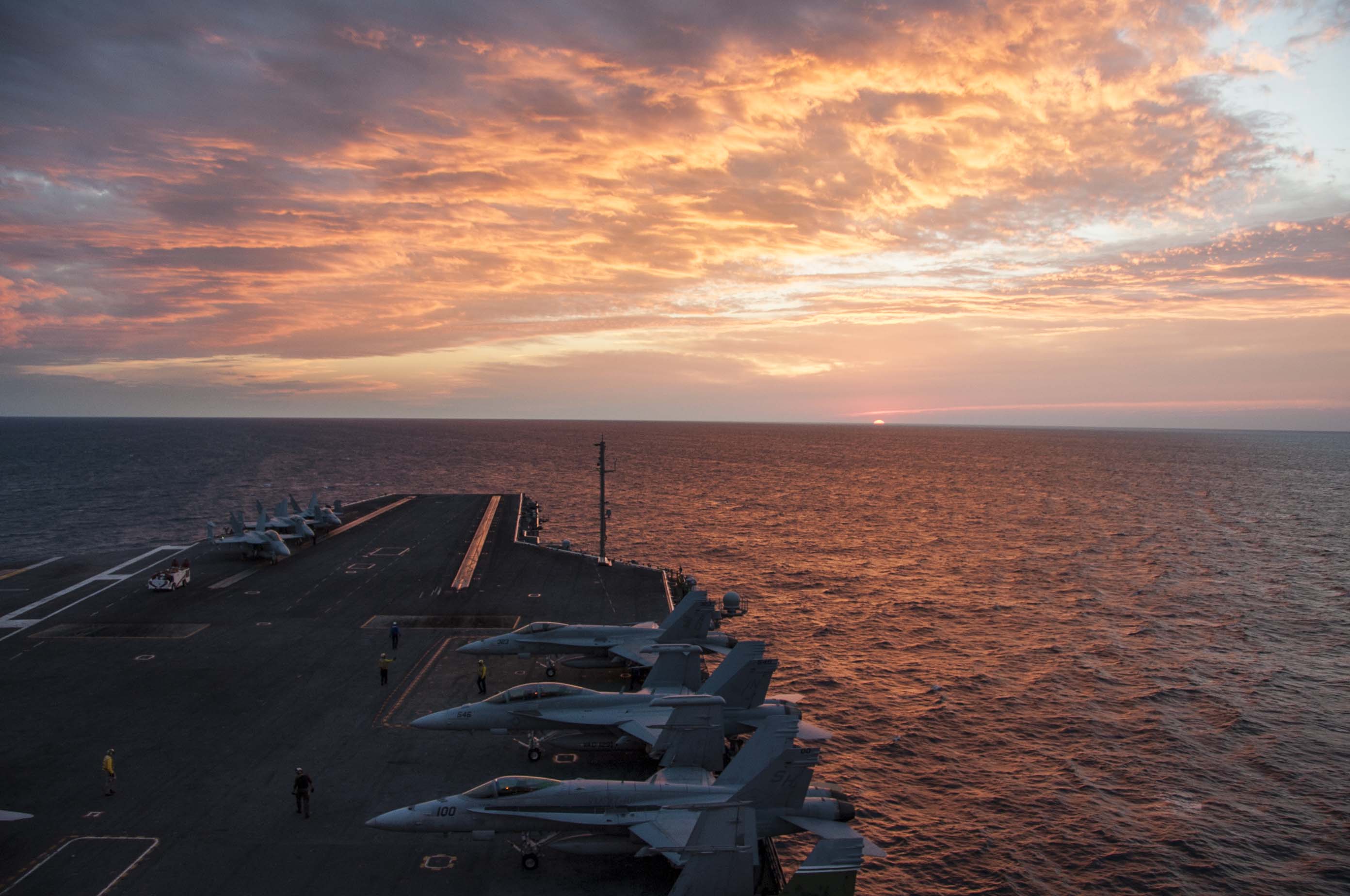 Aircraft sit on the flight deck of the aircraft carrier USS Theodore Roosevelt (CVN-71) on Oct. 29, 2014. US Navy Photo