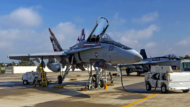 An F/A-18 Hornet with Marine Fighter Attack Squadron 115 awaits maintenance during Exercise Max Thunder 14-2, aboard Kunsan Air Base, Republic Of Korea, Nov. 14, 2014. US Marine Corps photo.