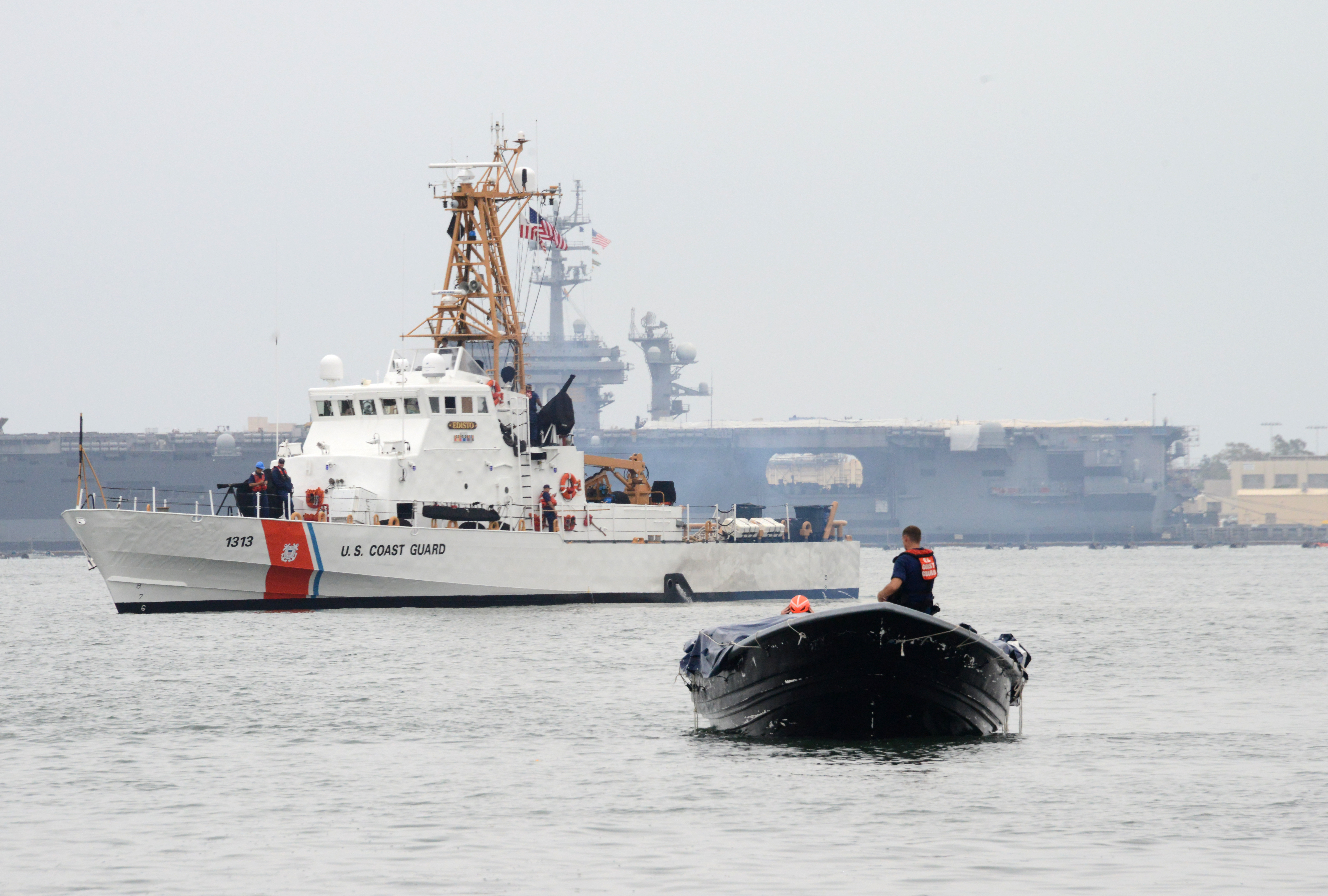 U.S. Coast Guard Cutter Edisto brings a seized drug-laden panga boat into San Diego Bay June 28, 2014. US Coast Guard Photo