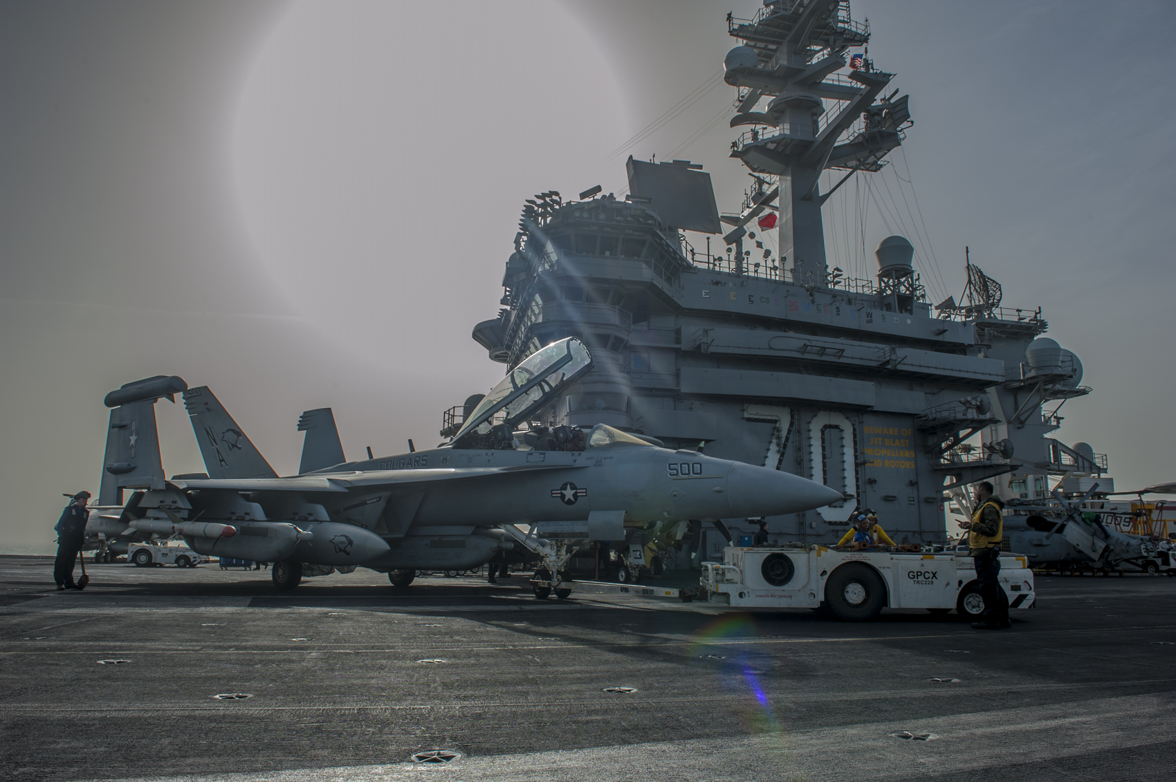 an EA-18G Growler from the Cougars of Electronic Attack Squadron (VAQ) 139 on the flight deck of the Nimitz-class aircraft carrier USS Carl Vinson (CVN 70).