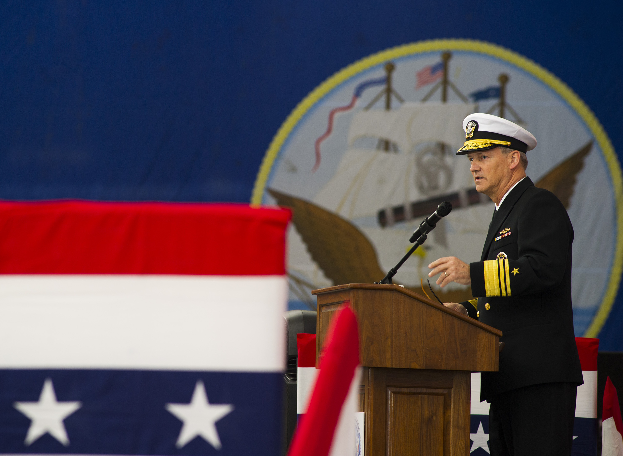 Vice Adm. Robert Thomas, commander of U.S. 7th Fleet, delivers remarks during a change of command ceremony aboard the Nimitz-class aircraft carrier USS George Washington (CVN-73). US Navy Photo
