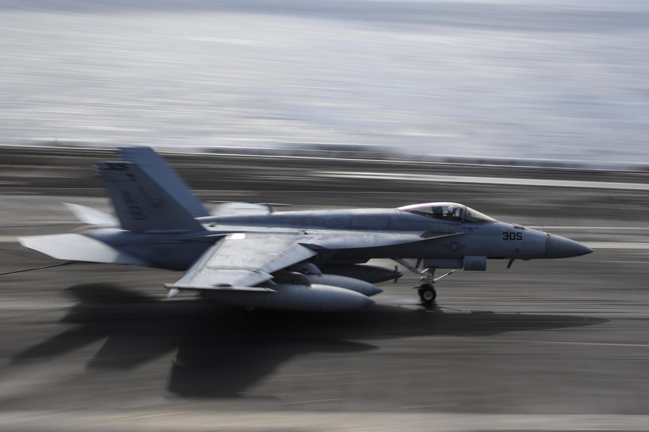 F/A-18E Super Hornet assigned to the Knighthawks of Strike Fighter Attack Squadron (VFA) 136 lands on the flight deck of the Nimitz-class aircraft carrier USS Theodore Roosevelt (CVN 71) on Jan. 30, 2015. US Navy Photo