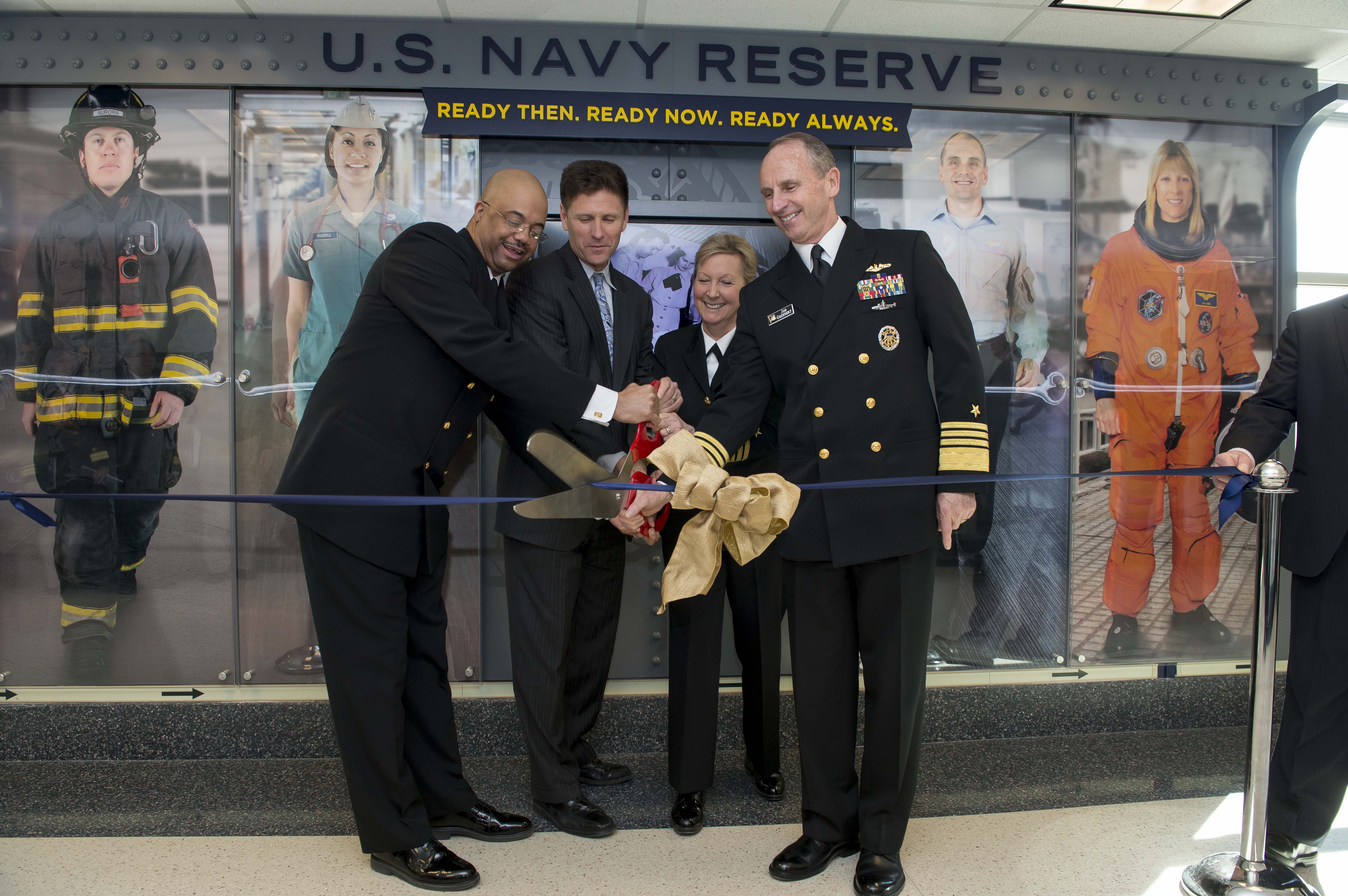 Chief of Naval Operations (CNO) Adm. Jonathan Greenert, Chief of Navy Reserve Vice Adm. Robin Braun, Assistant Secretary of the Navy for Manpower and Reserve Affairs Juan Garcia and Navy Reserve Force Master Chief C.J. Mitchell cut a ribbon in front of the new Centennial of the U.S. Navy Reserve display in the Pentagon on March 2, 2015. US Navy Photo