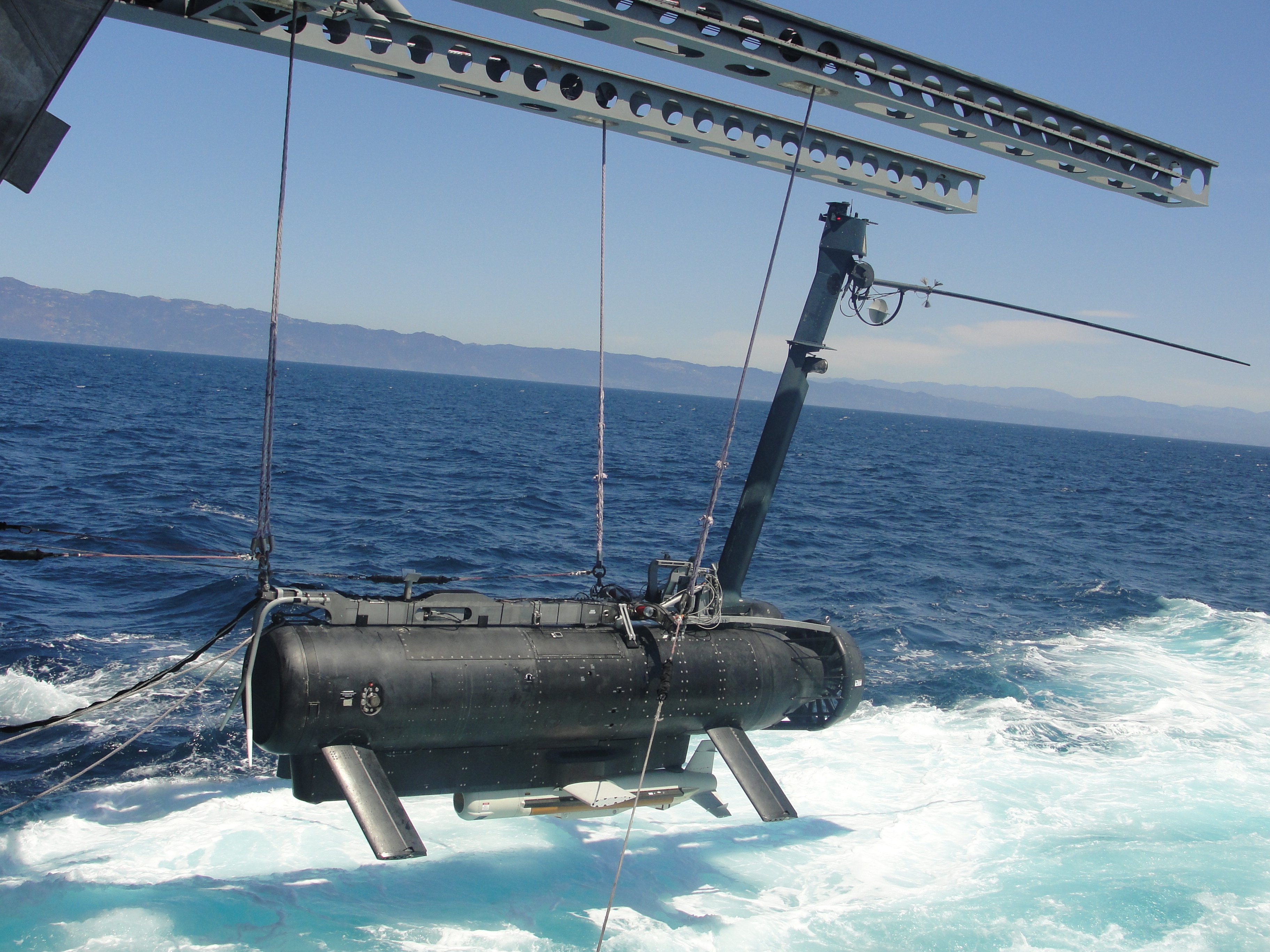 The littoral combat ship USS Independence (LCS-2) deploys a remote multi-mission vehicle (RMMV) while testing the ship's mine countermeasures mission package (MCM) off the southern California coast in August 2013. Austal USA photo. 