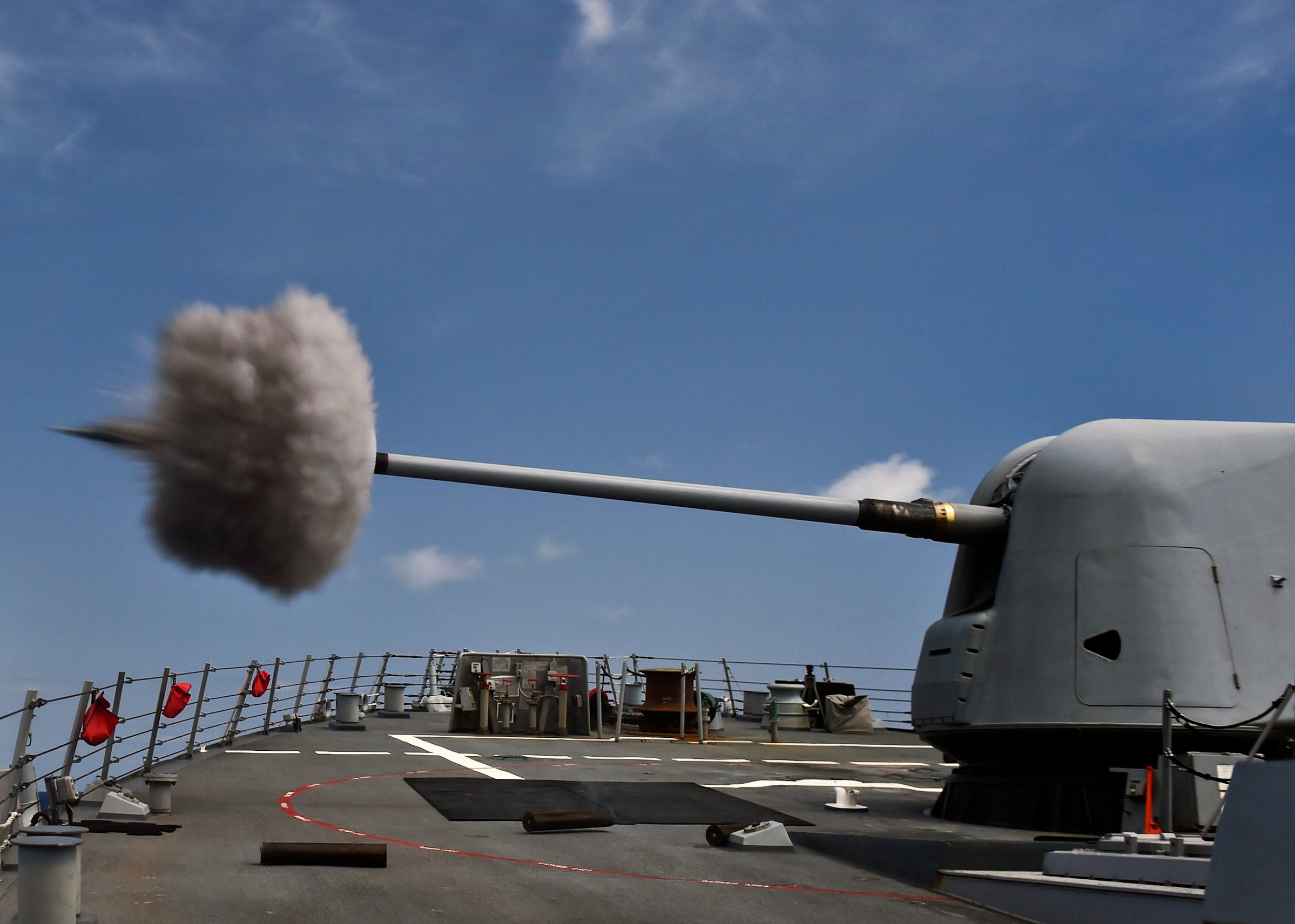 USS Porter (DDG-78) fires its MK 45 5-inch lightweight gun during a weapons training exercise on April 3, 2015. US Navy Photo