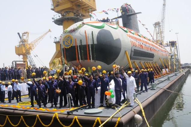 Workers of the Mazagon Dock Limited cheer after undocking of the first Scorpene-class submarine in Mumbai on Monday. Photo via The Hindu (http://www.thehindu.com/news/national/scorpene-submarine-nears-completion/article7074142.ece)