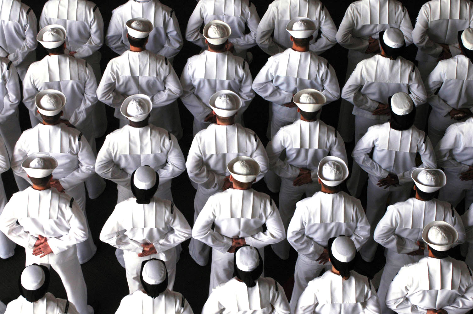 Sailors stand in formation during a change of command ceremony held aboard the Nimitz-class aircraft carrier USS John C. Stennis (CVN-74) in 2006. US Navy Photo
