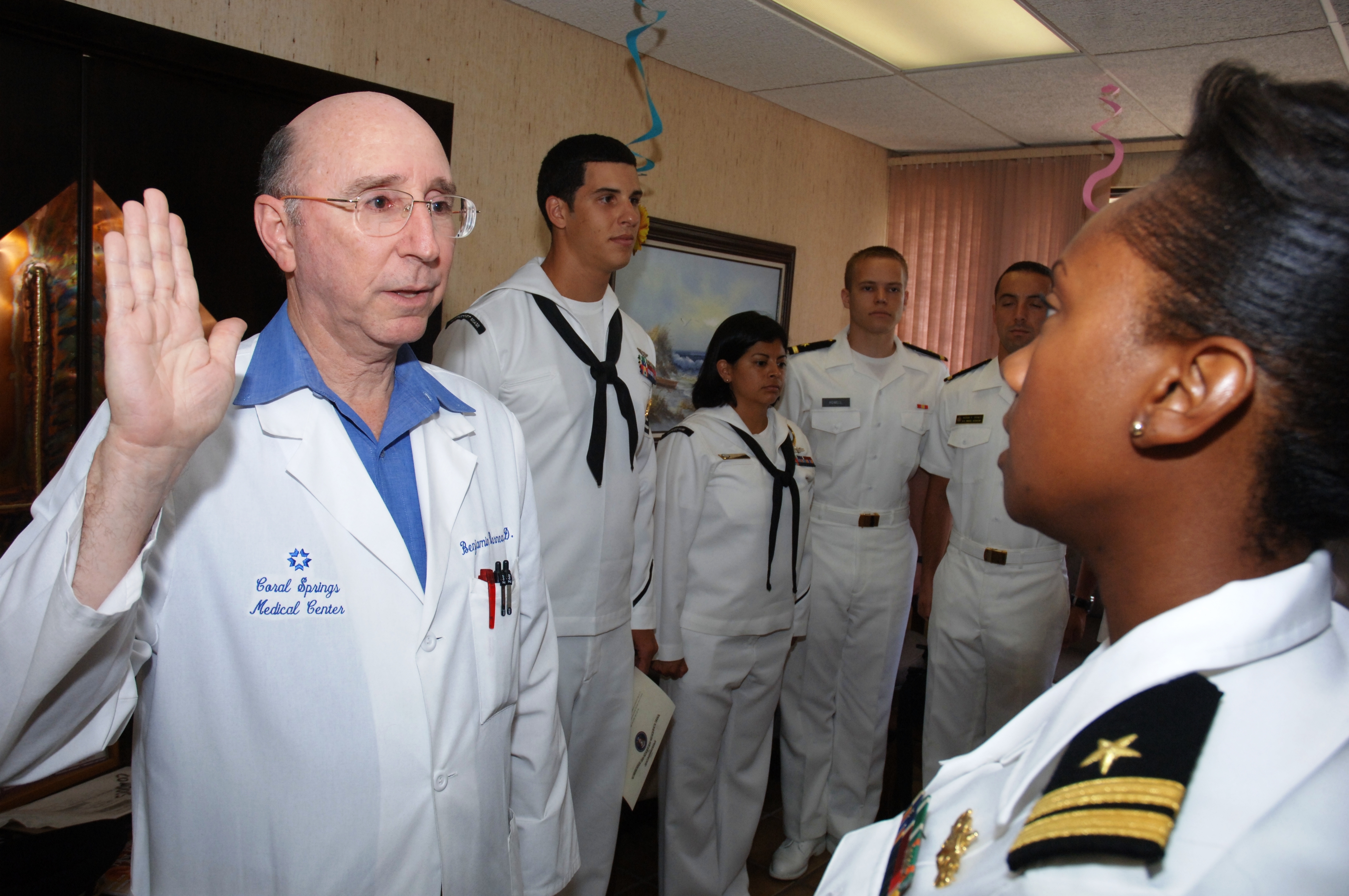 Dr. N. Benjamin Barnea is sworn in to the U.S. Navy Reserve Medical Corps by Lt. Sheree Williams in 2010. US Navy Photo