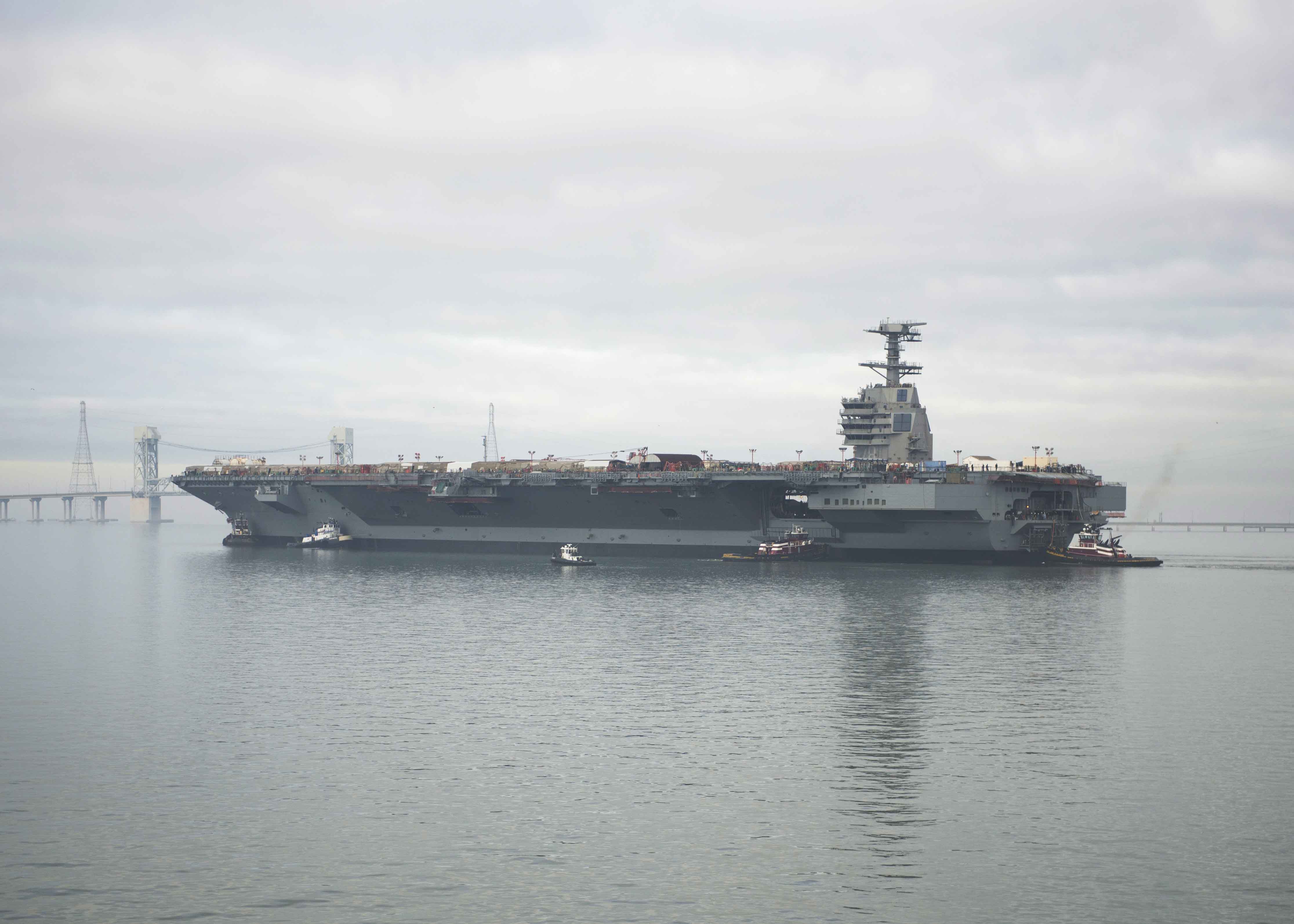 Pre-Commissioning Unit Gerald R. Ford (CVN 78) transits the James River during the ship’s launch and transit to Newport News Shipyard pier three for the final stages of construction and testing in November 2013. US Navy photo.