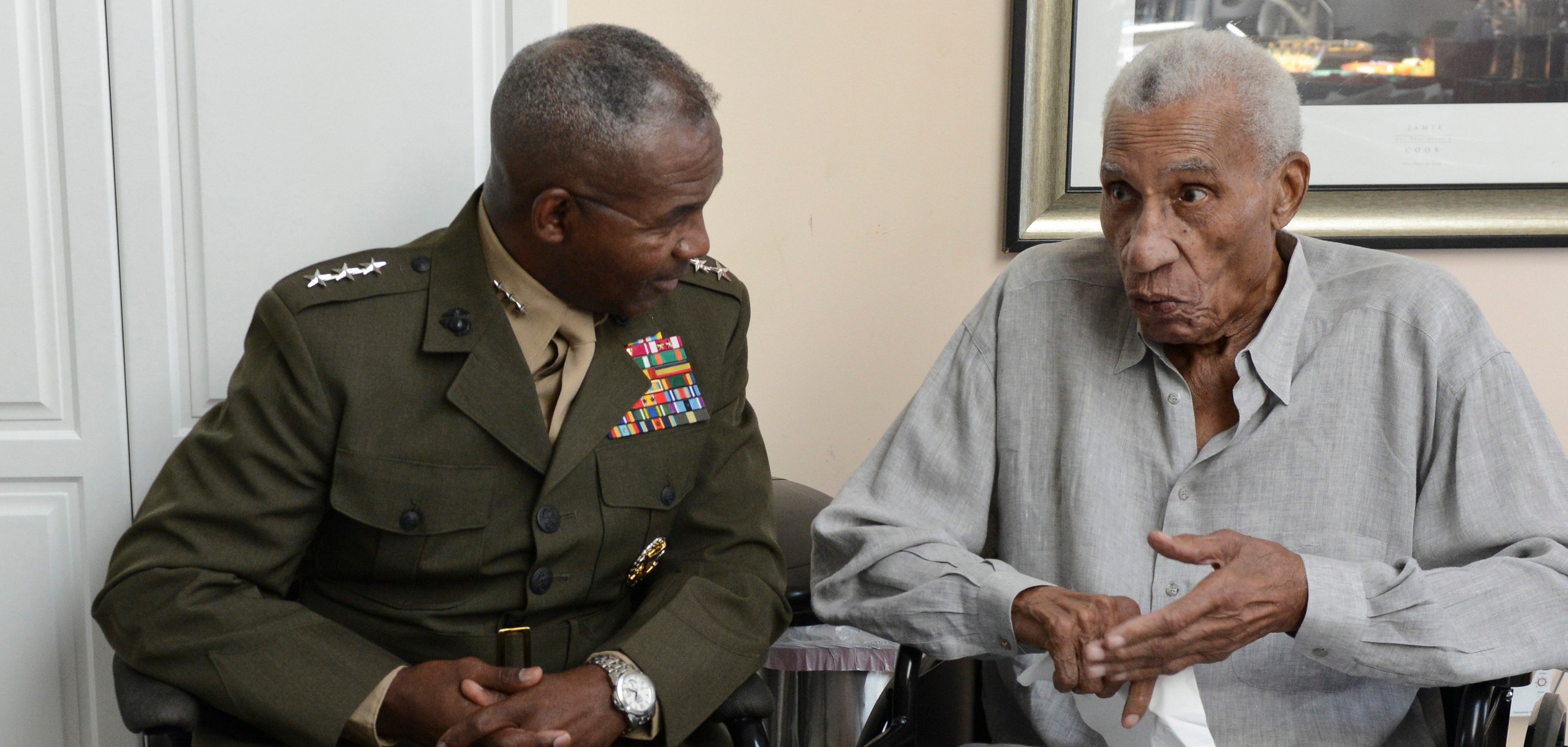 Lt. Gen. Frank E. Petersen, Jr. (ret), right, converses with Lt. Gen. Ronald Bailey, the deputy commandant for plans, policies, and operations with Headquarters Marine Corps in 2014. US Marine Corps
