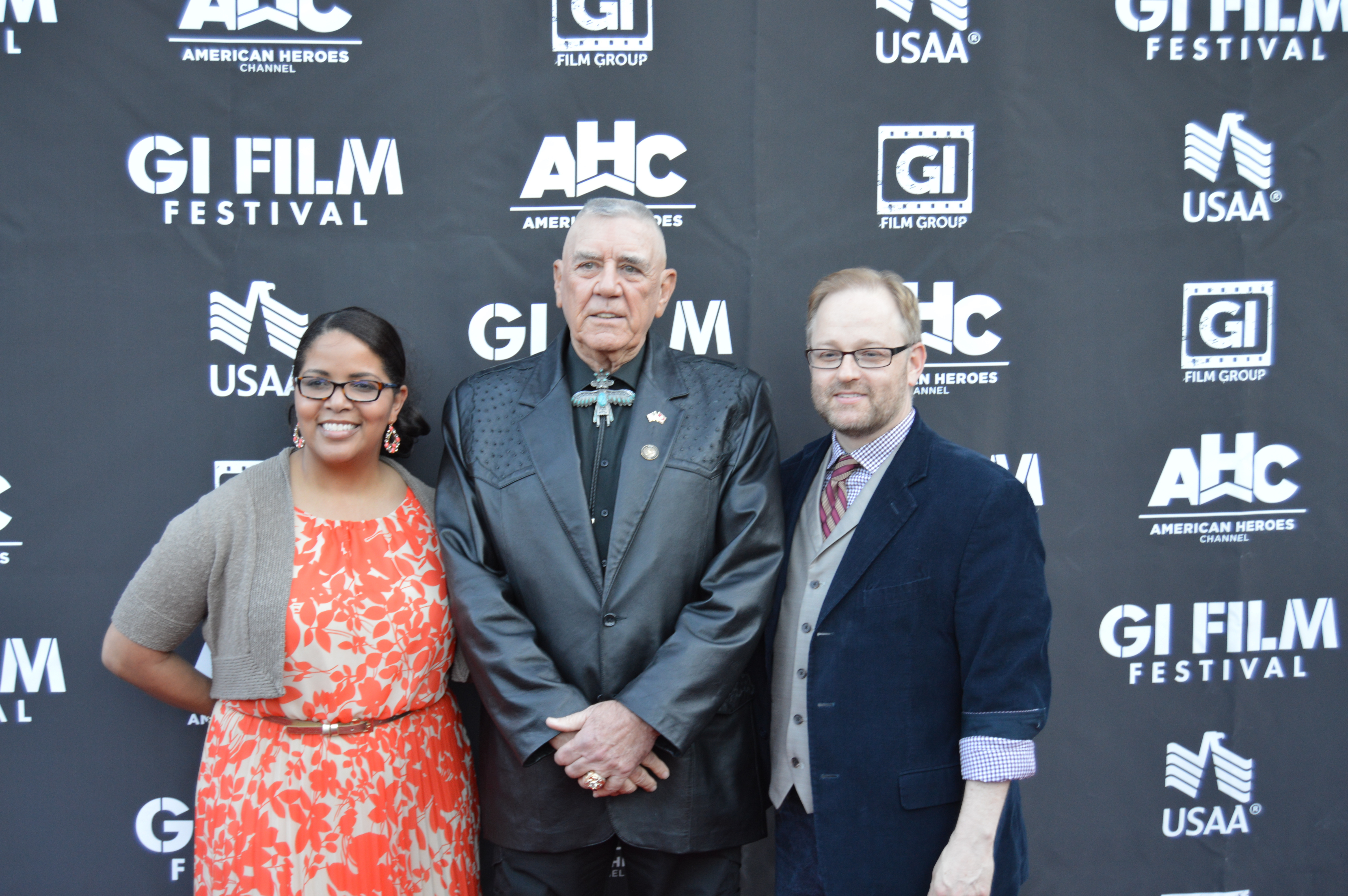 Actor and Marine R. Lee Ermey, center, stands with GI Film Festival organizers Laura Law-Millett and Brandon Millett on Saturday, May 23, 2015. USNI News photo.