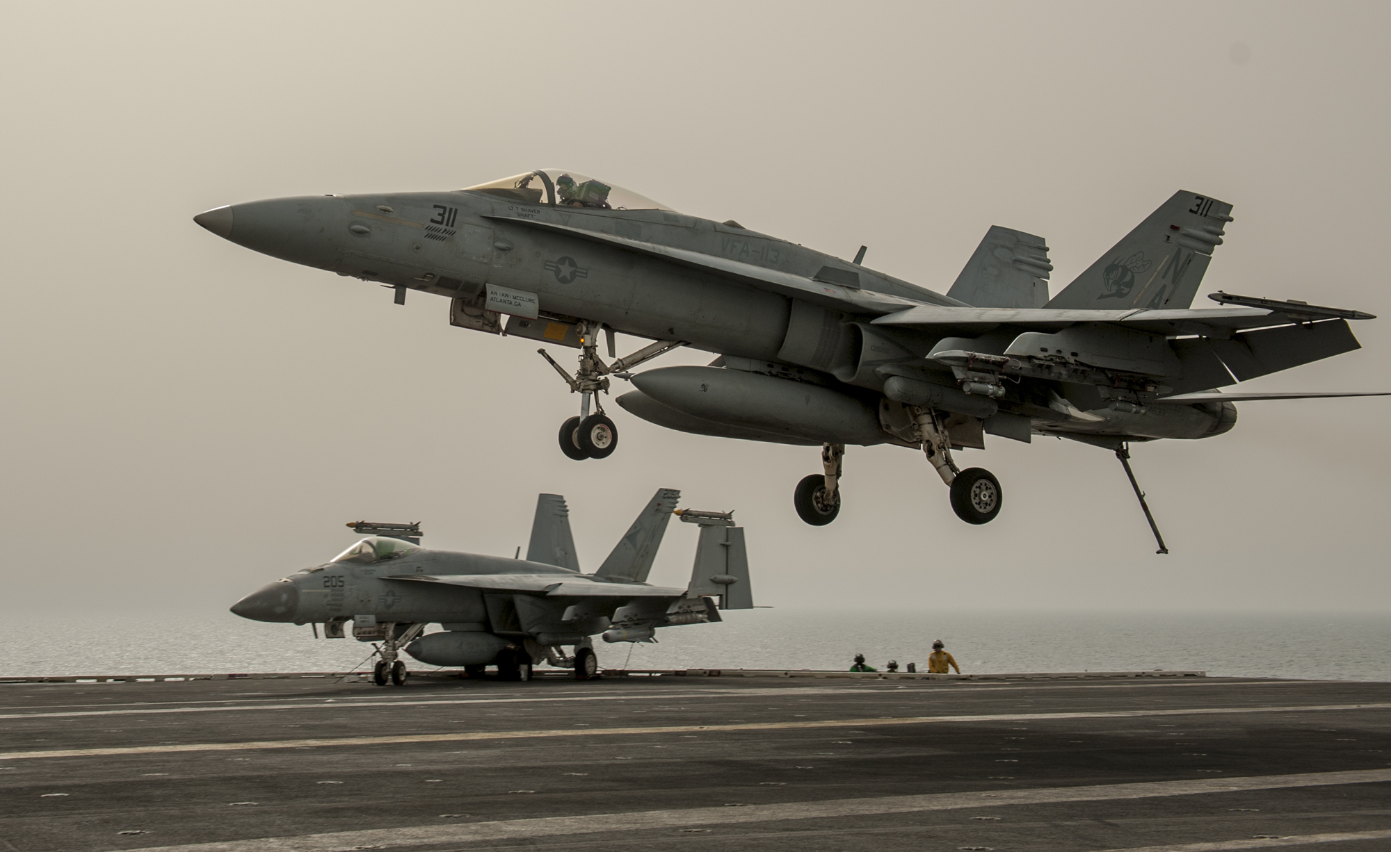 An F/A-18C Hornet attached to the Stingers of Strike Fighter Squadron (VFA) 113 makes an arrested recovery during the final flight operations in support of Operation Inherent Resolve aboard the aircraft carrier USS Carl Vinson (CVN 70) on April 11, 2015. US Navy photo.