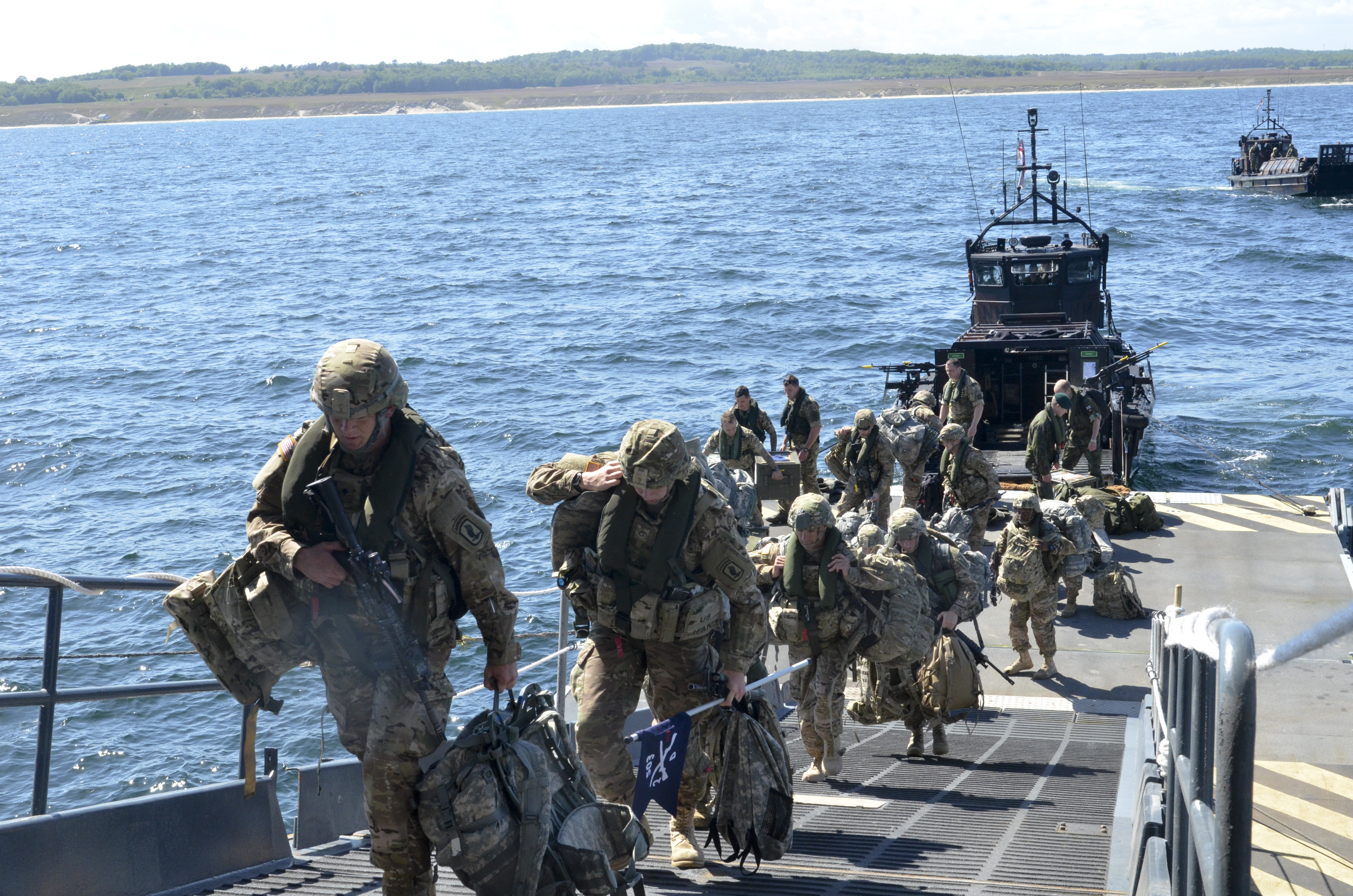 US Army paratroopers from the 173rd Airborne Brigade embark aboard the Royal Navy amphibious helicopter carrier HMS Ocean during exercise Baltic Operations (BALTOPS) 2015 on June 9, 2015. US Navy Photo