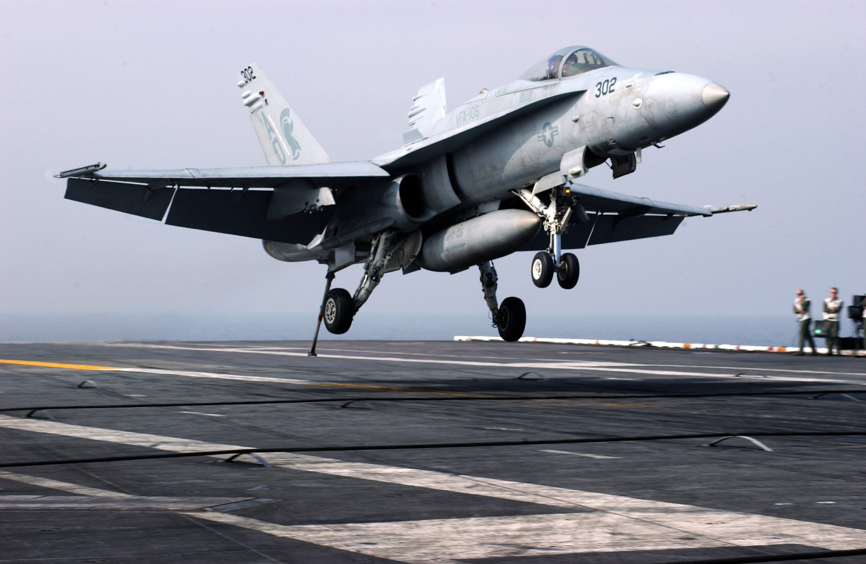 An F/A-18C Hornet assigned to the "Gladiators" of Strike Fighter Squadron 106 (VFA-106) makes an arrested landing aboard USS Theodore Roosevelt in 2006. US Navy Photo