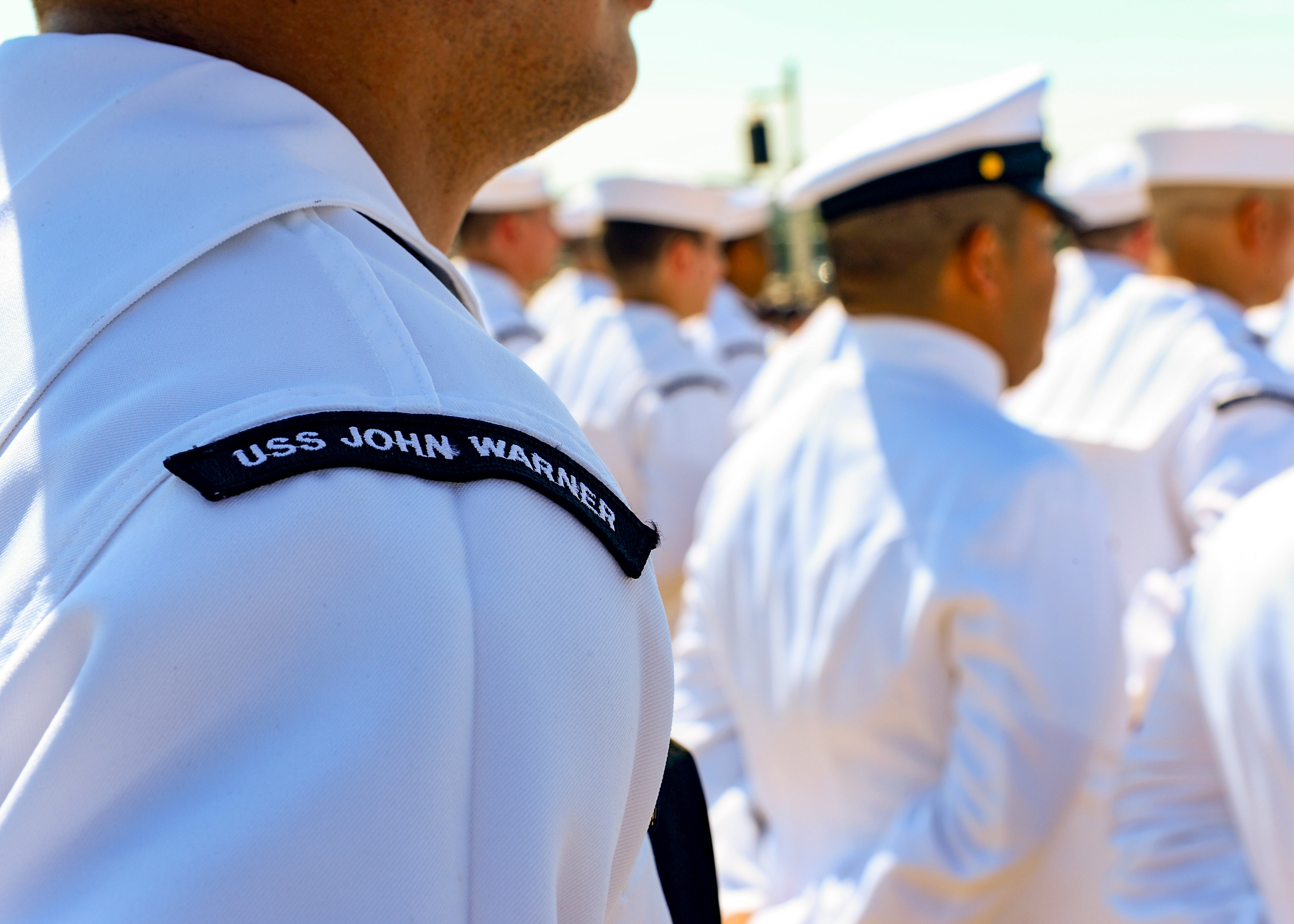 Sailors stand during the commissioning ceremony of the USS John Warner (SSN-785) on Aug. 1, 2015. 