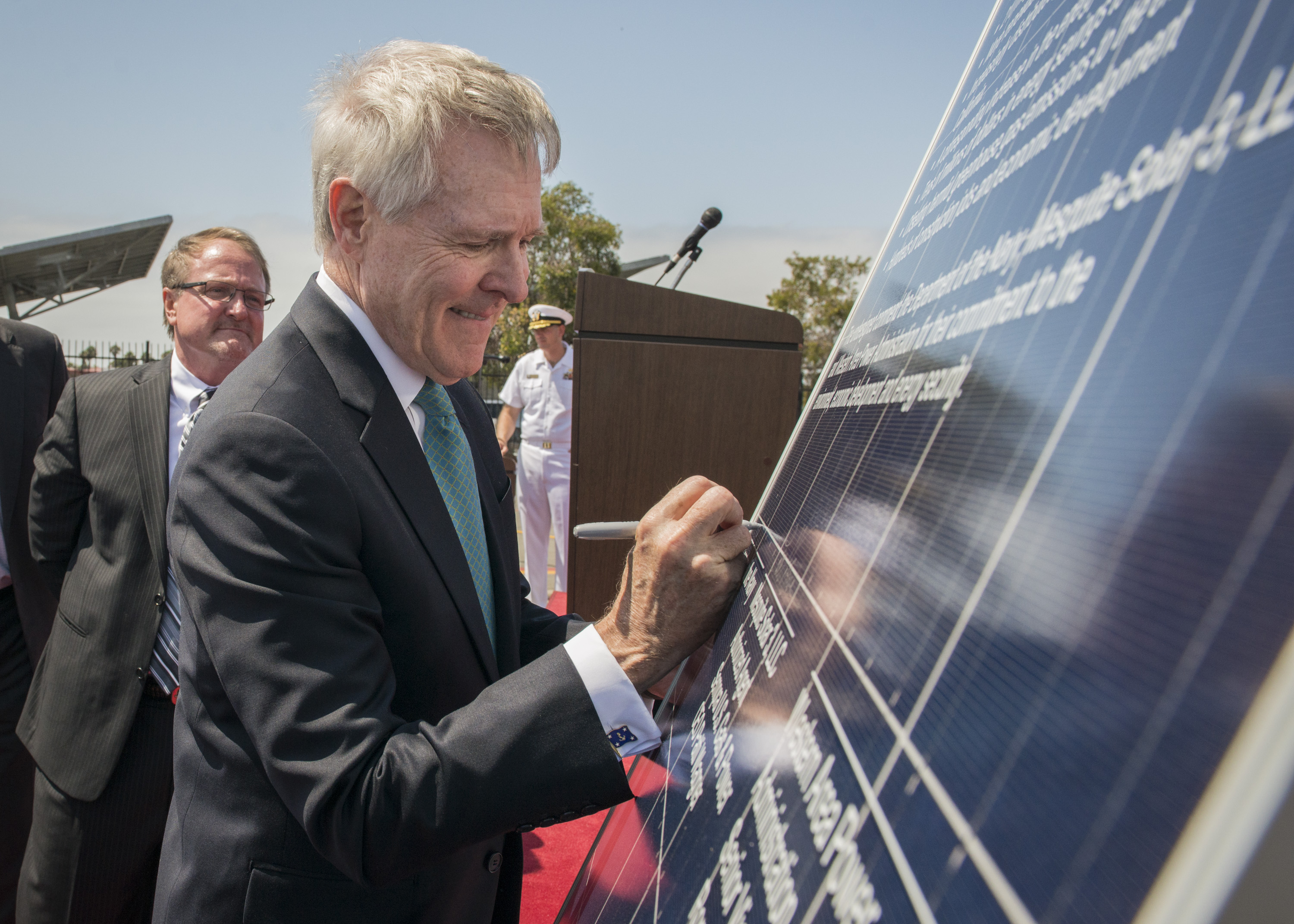 Secretary of the Navy (SECNAV) Ray Mabus signs a solar panel during a ceremony commemorating an agreement with Western Area Power Administration and Sempra U.S. Gas & Power to construct a 210 megawatt direct current solar facility. US Navy Photo