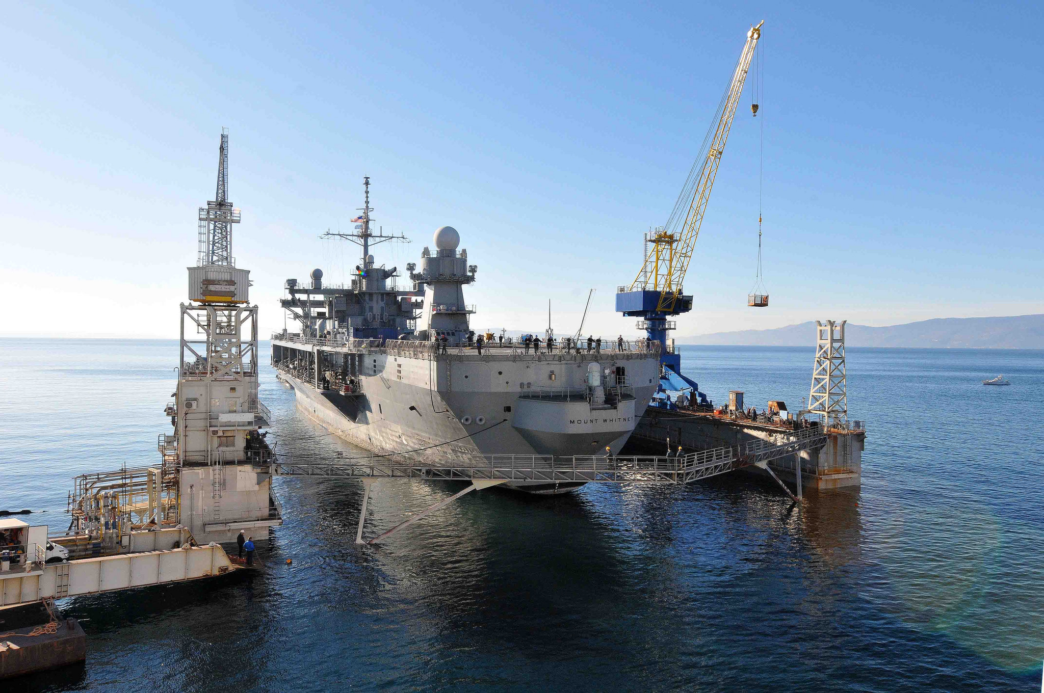 USS Mount Whitney (LCC20) is tugged in to the staging area to begin the dry dock process in the Viktor Lenac Shipyard in Rijeka, Croatia on Jan. 19, 2015. US Navy 