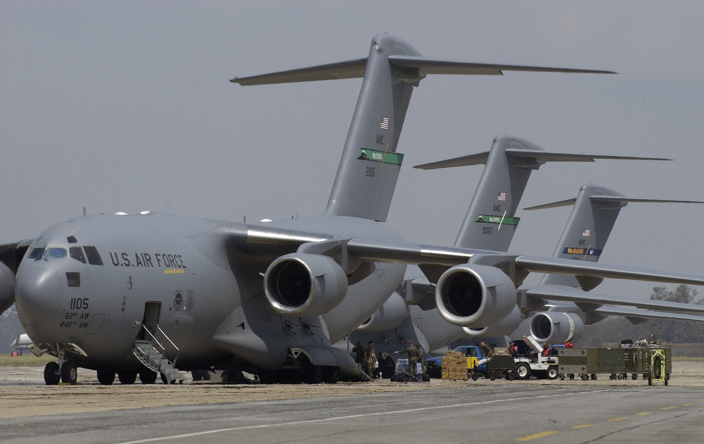 Three U.S. Air Force C-17 Globemaster III aircraft offload tons of equipment in Mississippi on Aug. 31, 2015. US Air Force Photo