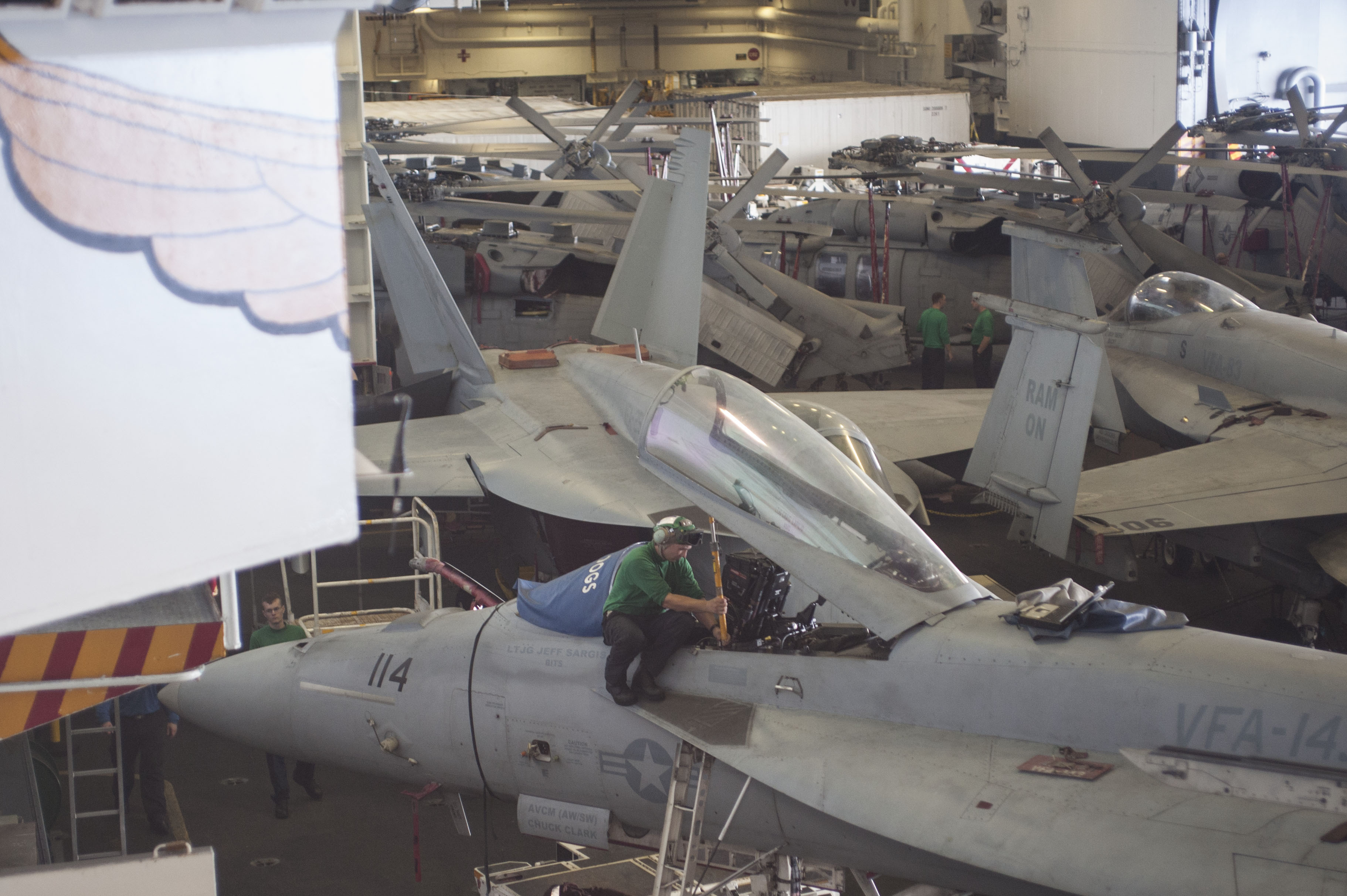 150617-N-OW828-023 ATLANTIC OCEAN (June 17, 2015) Aviation Structural Mechanic (Equipment) 2nd Class M. V. Volosko, assigned to the Pukin Dogs of Strike Fighter Squadron (VFA) 143, places a canopy brace on an F/A-18E Super Hornet in the hangar bay of the aircraft carrier USS Harry S. Truman (CVN 75). Harry S. Truman is underway conducting tailored ship’s training availability (TSTA) off the east coast of the United States. TSTA is the first combined training event of a ship's inter-deployment training cycle that tests and evaluates shipboard drills, including general quarters, damage control, medical and firefighting. Upon successful completion of TSTA, Harry S. Truman will be considered proficient in all mission areas. (U.S. Navy photo by Mass Communication Specialist Seaman J. A. Mateo/Released)