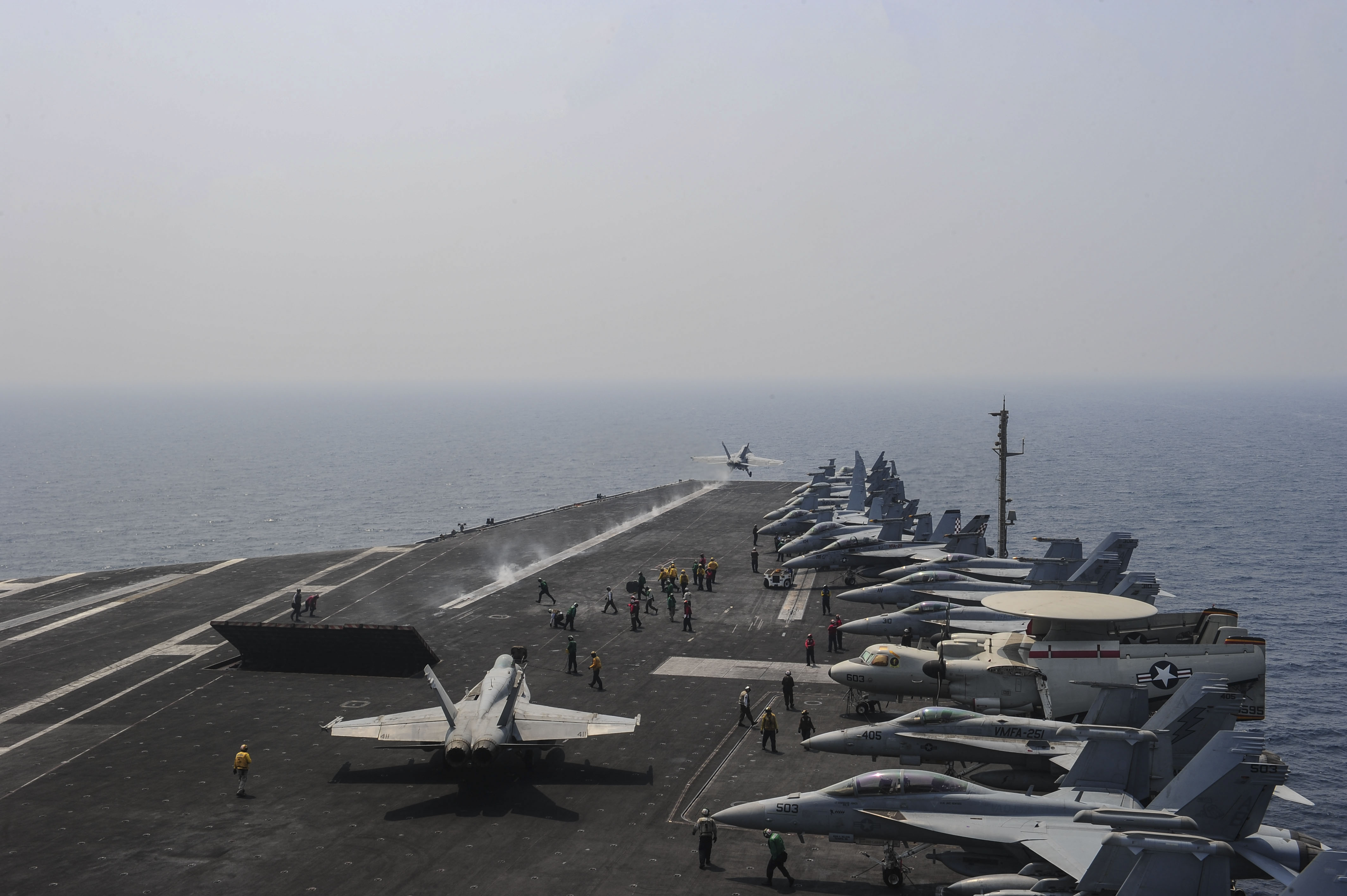 An F/A-18F Super Hornet assigned to the Checkmates of Strike Fighter Squadron (VFA) 211 launches from the flight deck aboard the aircraft carrier USS Theodore Roosevelt (CVN 71) on Aug. 20, 2015. US Navy photo. 