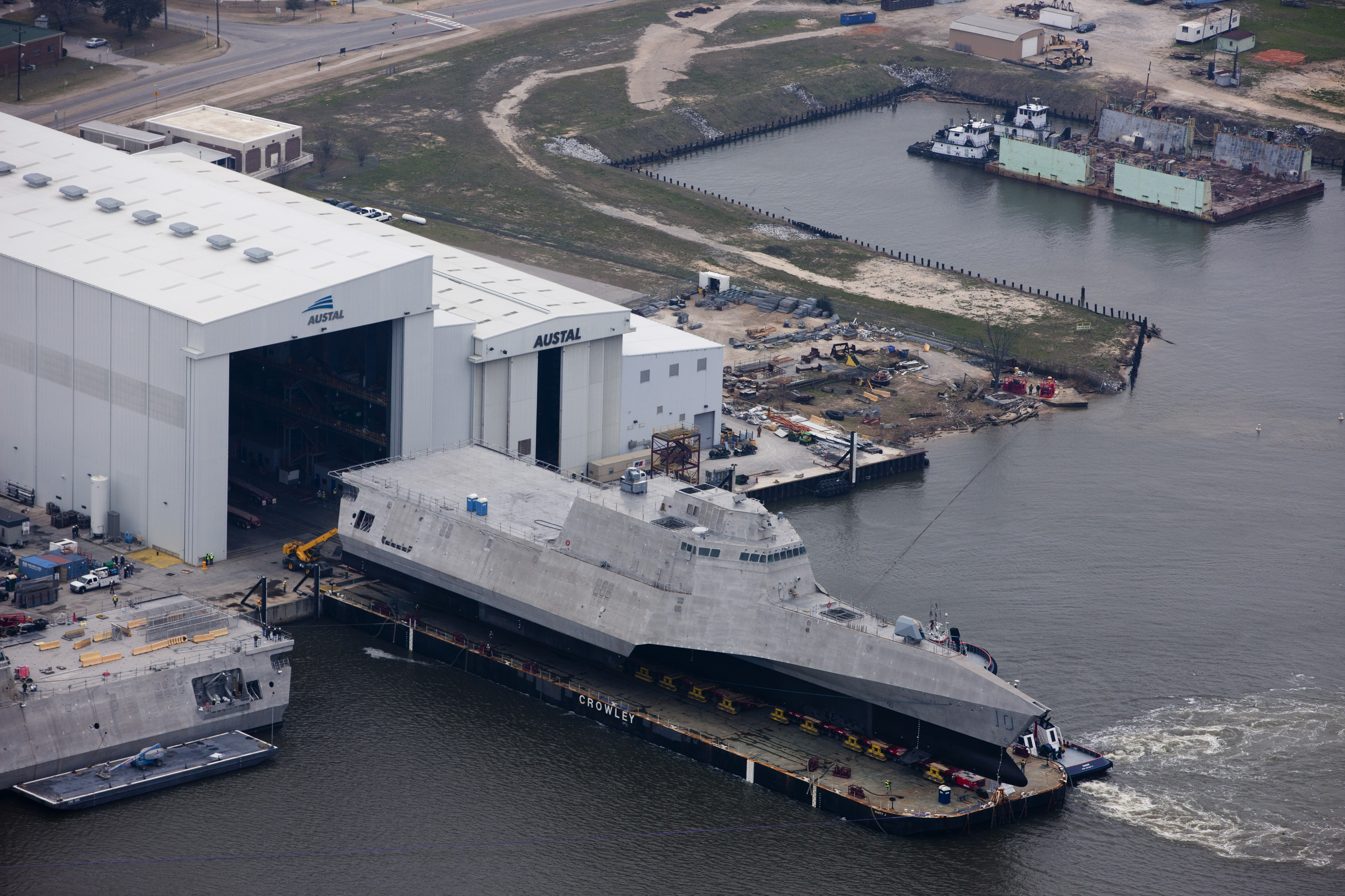 150224-N-EW716-002 MOBILE, Ala. (Feb. 24, 2015) An aerial view of the future littoral combat ship USS Gabrielle Giffords (LCS 10) during its launch sequence at the Austal USA shipyard. The launch of the Gabrielle Giffords marks an important production milestone for the littoral combat ship program. (U.S. Navy photo/Released)