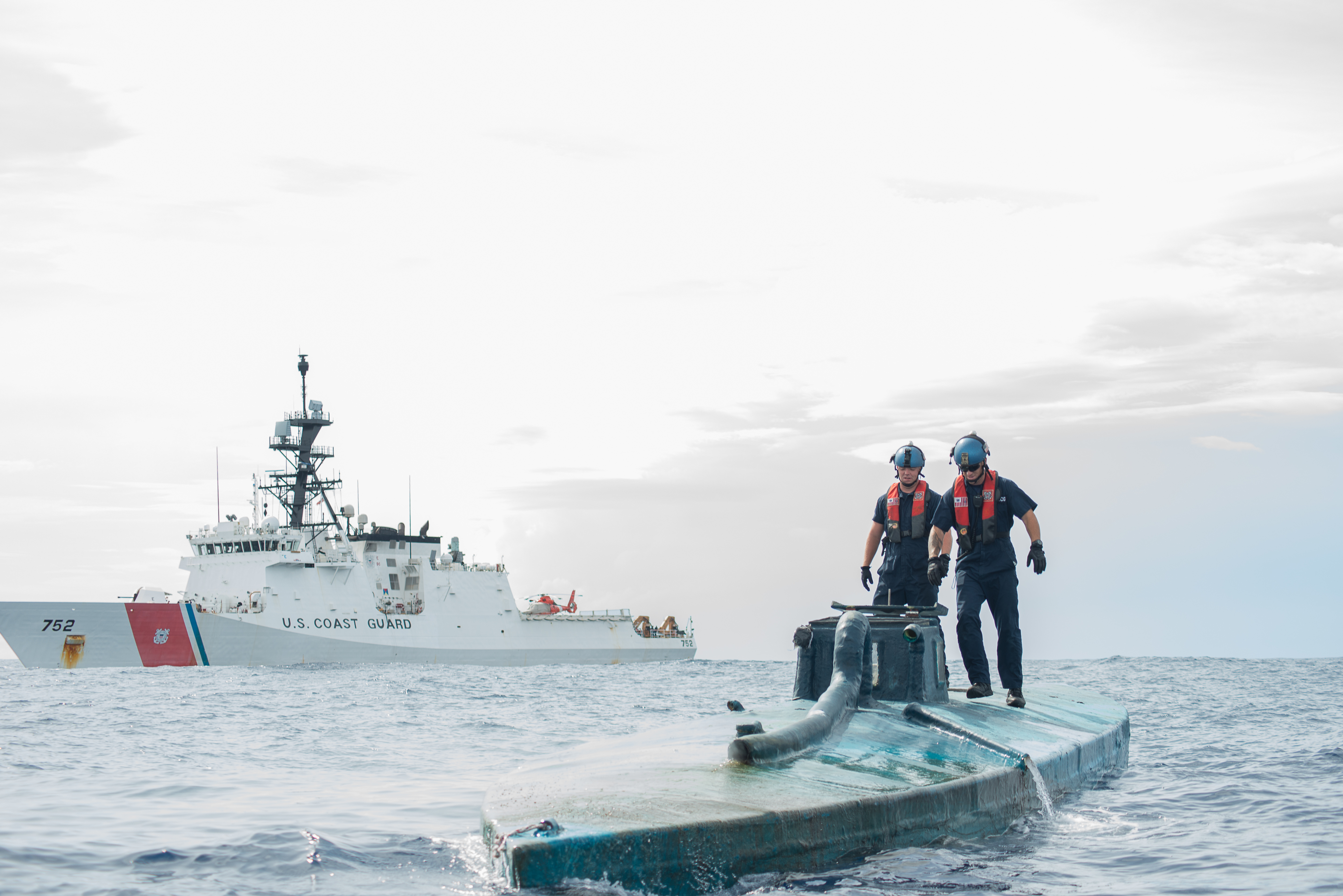 A Coast Guard Cutter Stratton boarding team investigates a self-propelled semi-submersible interdicted in international waters off the coast of Central America on July 19, 2015. US Coast Guard Photo