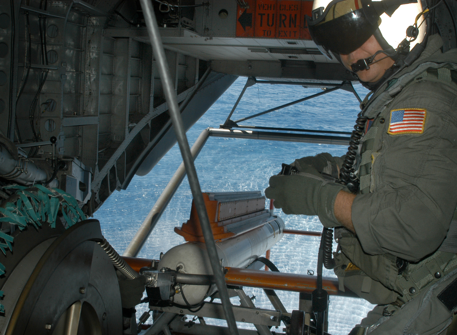 Aviation Electrician's Mate 2nd Class Tony Lio maneuvers an AQS-24 mine locator during a mine countermeasure operation during the Rim of the Pacific 2004 exercise. US Navy photo.
