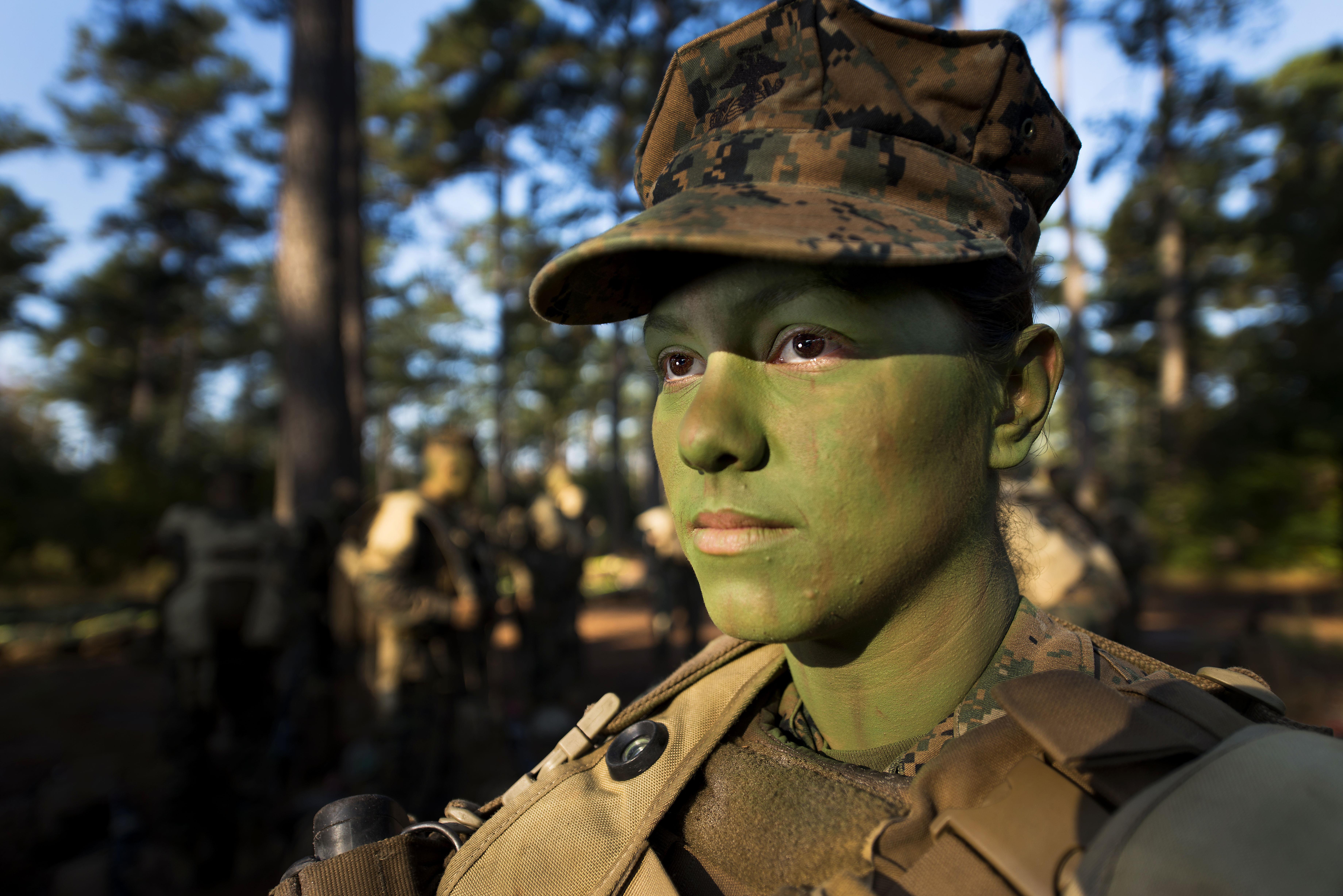  Pfc. Christina Fuentes Montenegro prepares to hike to her platoon's defensive position during patrol week of Infantry Training Battalion near Camp Geiger, N.C. on Oct. 31, 2013. US Marine Corps Photo