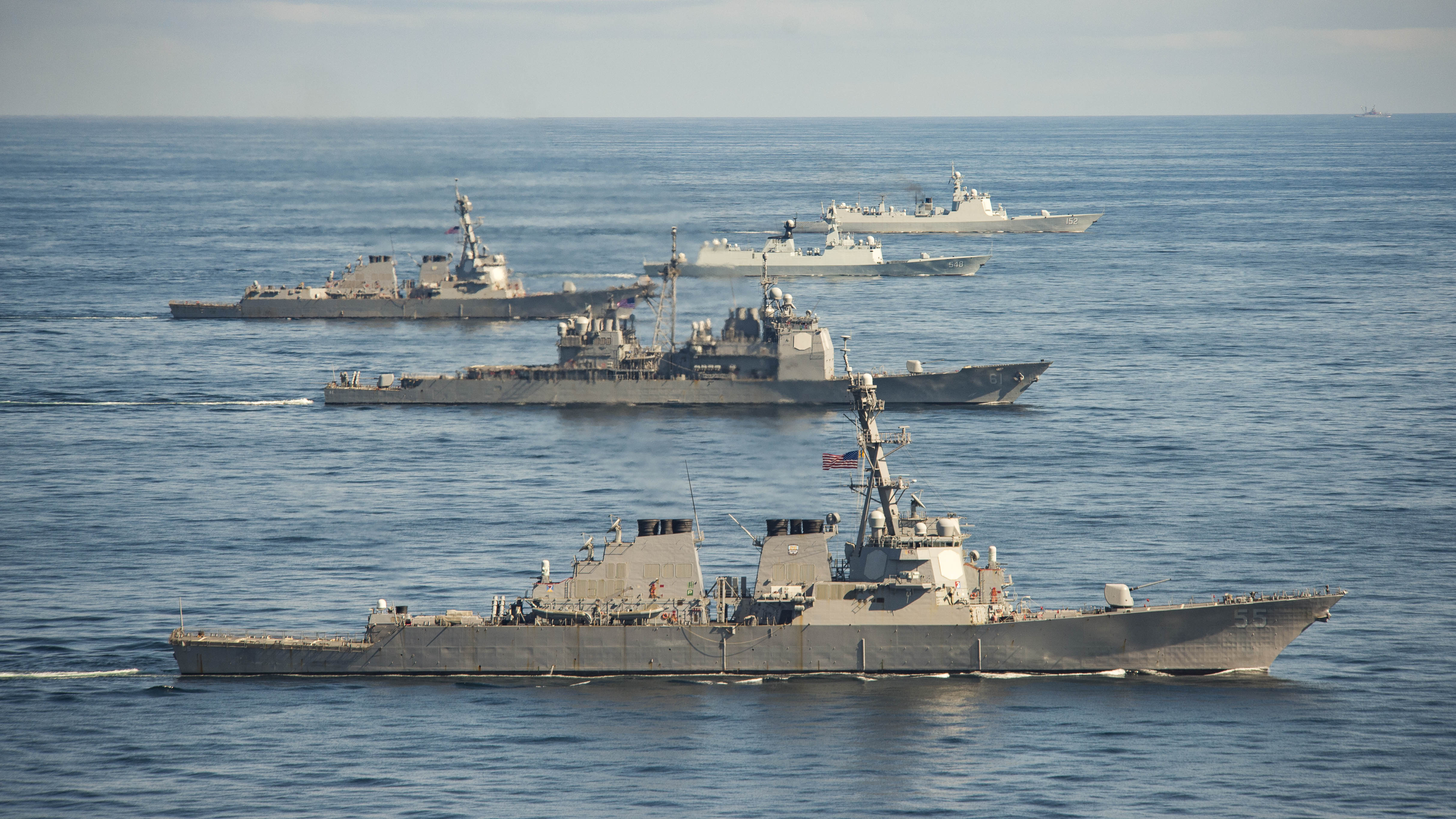 The Chinese Luyang II-class guided missile destroyer Jinan (DDG 152), top, the Jiangkai-class frigate Yiyang (FFG 548), the Arleigh Burke-class guided missile destroyer USS Mason (DDG 87), center, the Ticonderoga-class guided missile cruiser USS Monterey (CG 61) and the Arleigh Burke-class guided missile destroyer USS Stout (DDG 55), bottom, steam in formation during a passing exercise on Nov. 7, 2015, in the Atlantic Ocean. US Navy photo.