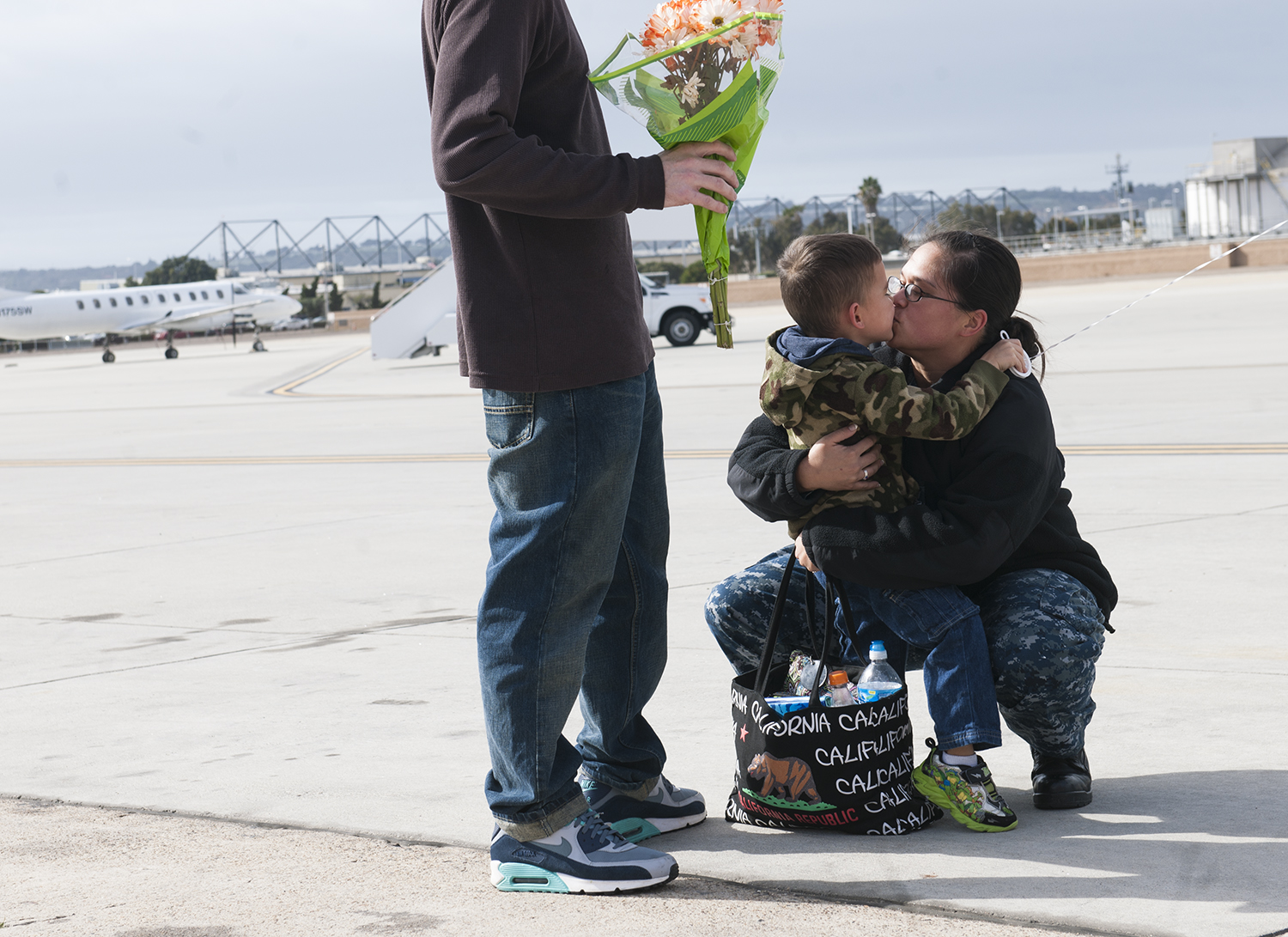 Electronics Technician 2nd Class Reane Clark greets her son after returning home from a deployment around South America. US Navy Photo