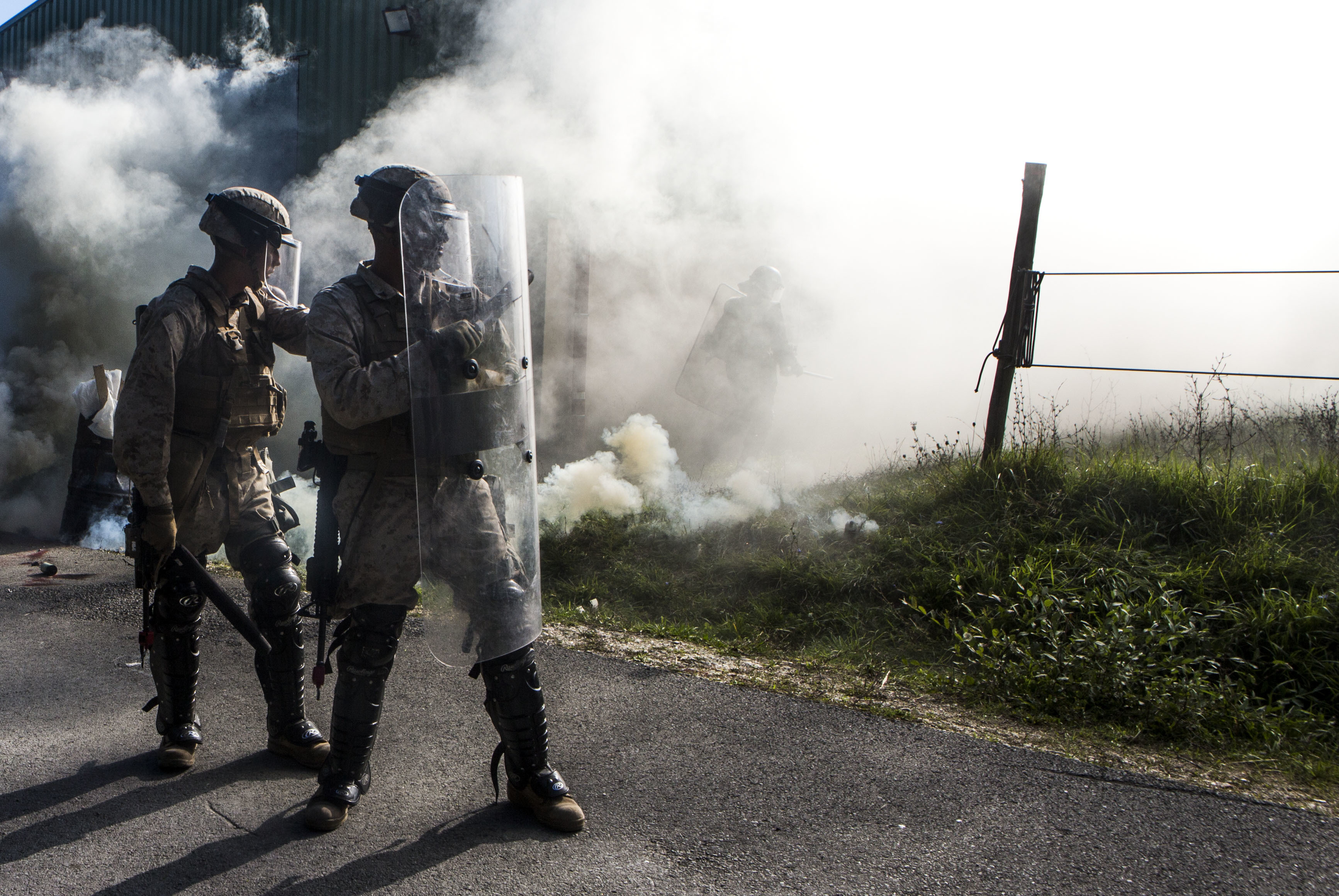 U.S. Marines stand guard during a simulated civilian evacuation at the National Gendarmerie Tactical Training Center in Saint-Astier, France, Oct. 9, 2015. The exercise marks the third rotation of Special-Purpose Marine Air-Ground Task Force Crisis Response-Africa Marines training alongside the Gendarmerie. US Marine Corps photo.