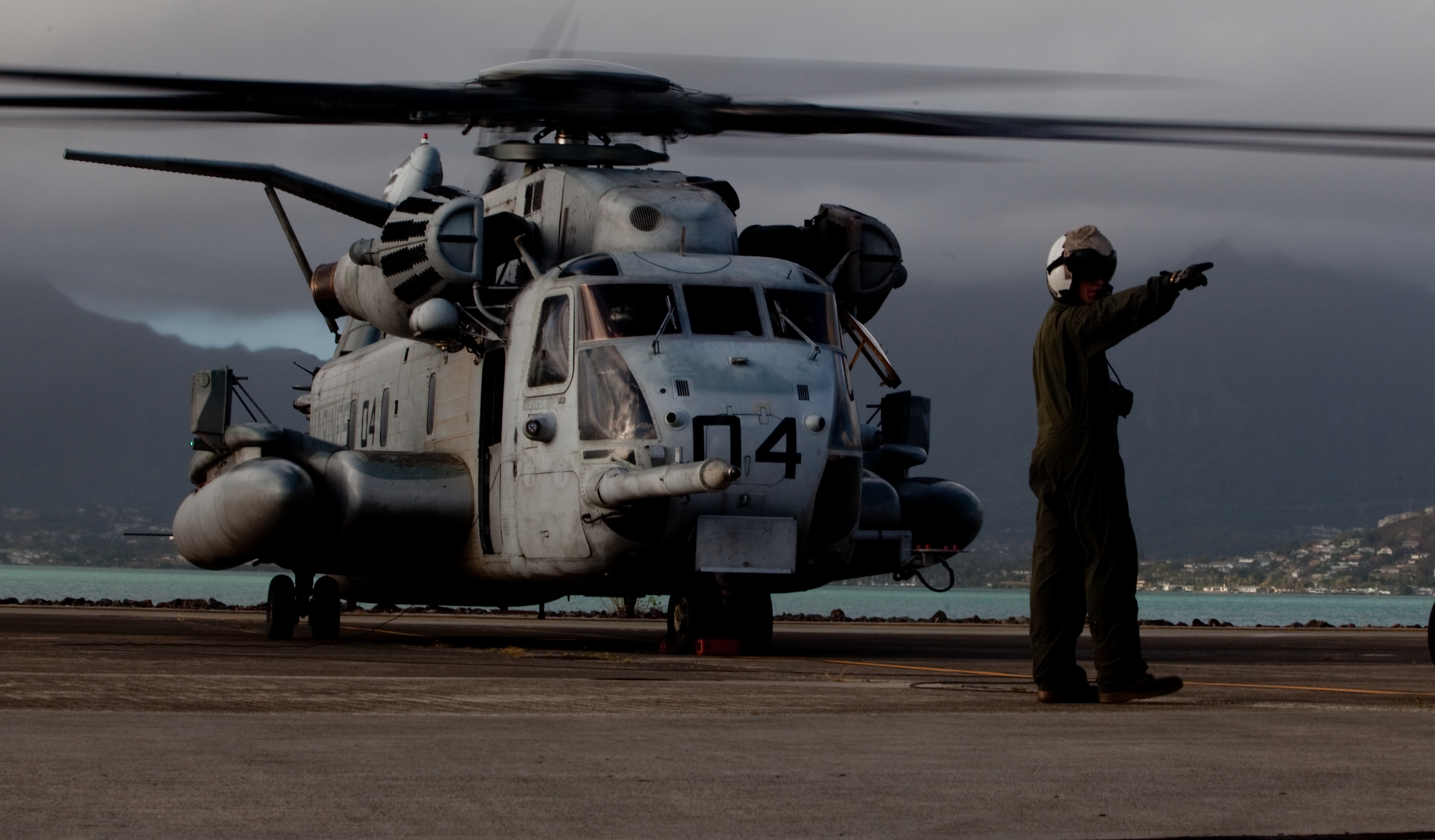 A Marine with Marine Heavy Helicopter Squadron 463 taxis a CH-53E Super Stallion onto the flight line at Marine Corps Air Station, Kaneohe Bay on Feb. 21, 2012. US Marine Corps photo.