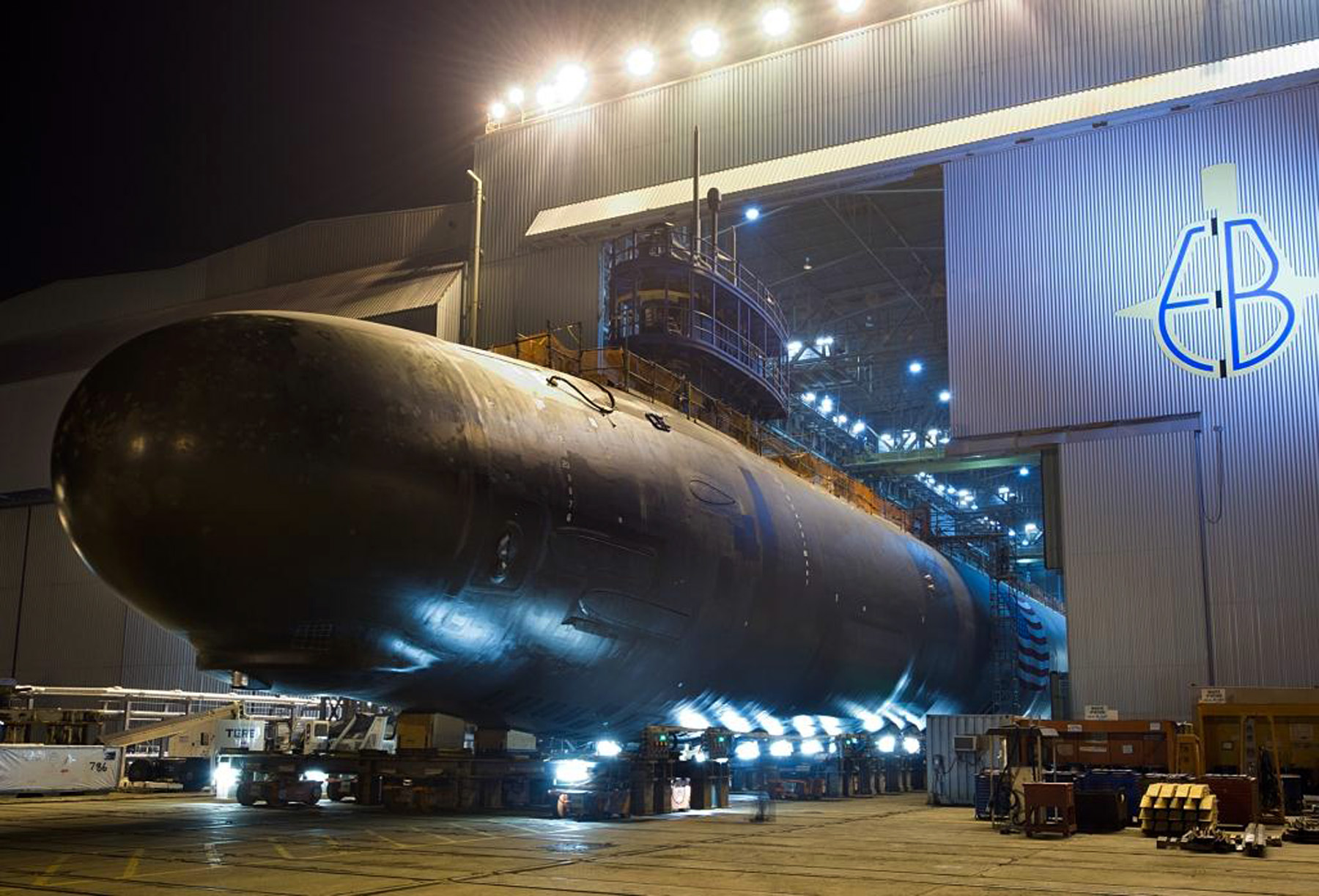 The Virginia-class attack submarine North Dakota (SSN-784) is rolled out of an indoor shipyard facility at General Dynamics Electric Boat in Groton, Conn., in Sept. 2013. US Navy photo.