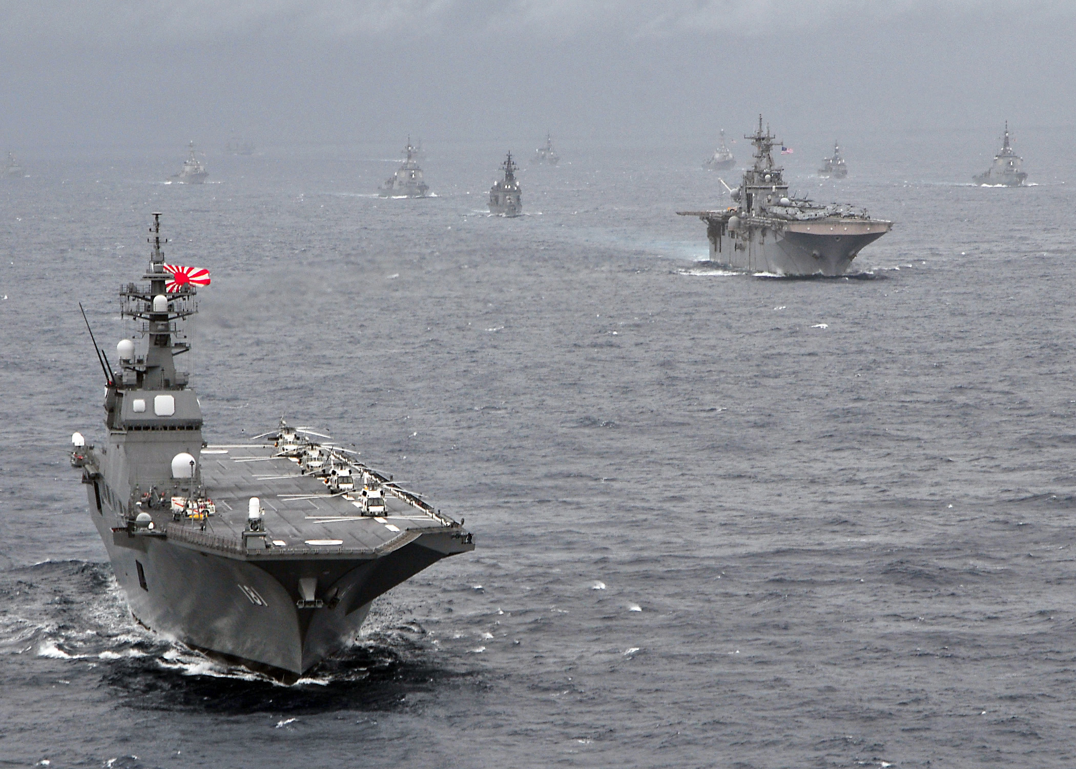 Japan Maritime Self-Defense Force helicopter destroyer JS Hyuga (DDH-181) leads a formation of US Navy and Japan Maritime Self-Defense Force ships in 2009. US Navy Photo