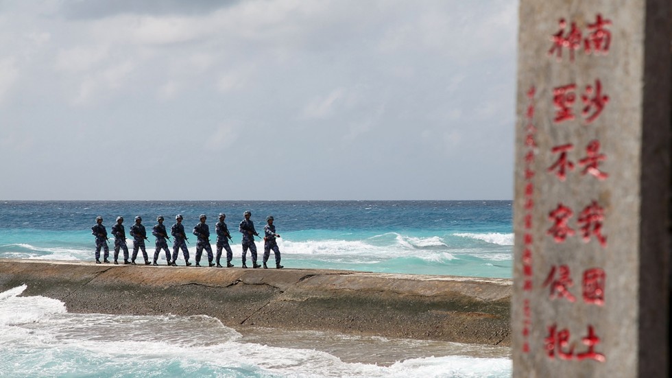 Chinese troops patrol disputed holding in the Spratly Islands. Photo via Reuters
