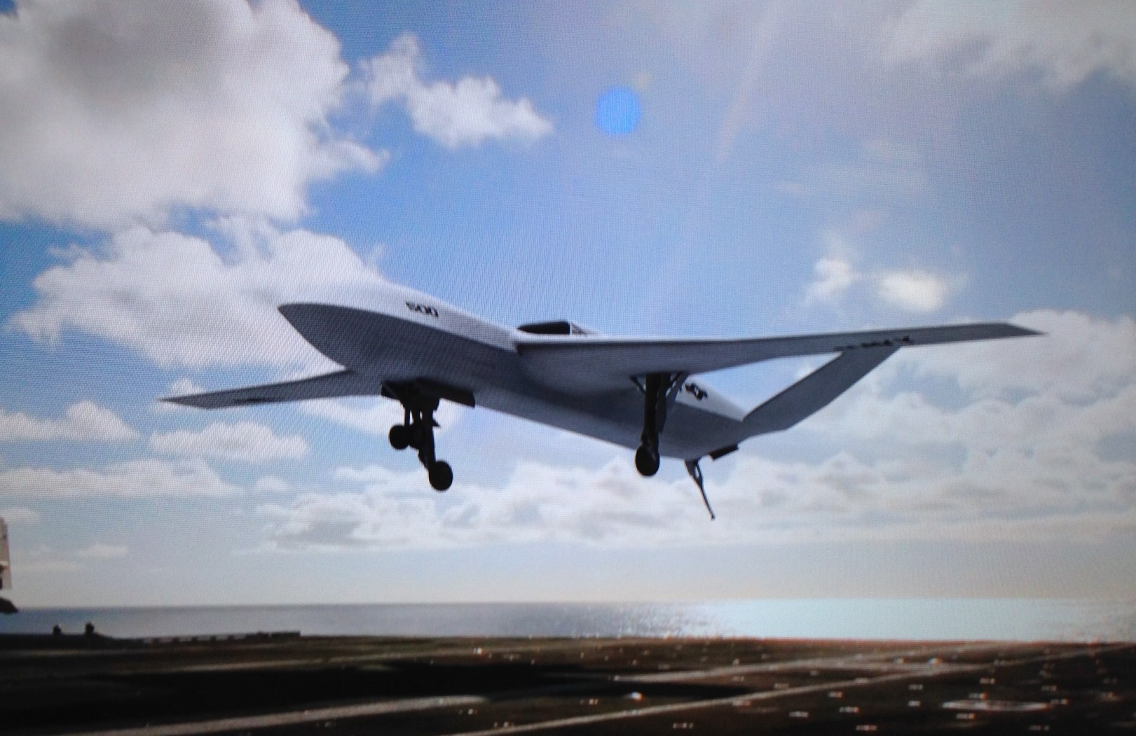 An artist’s concept of the General Atomics Sea Avenger taken from a display monitor. The design shows a wing-body-tail configuration US Naval Institute Photo