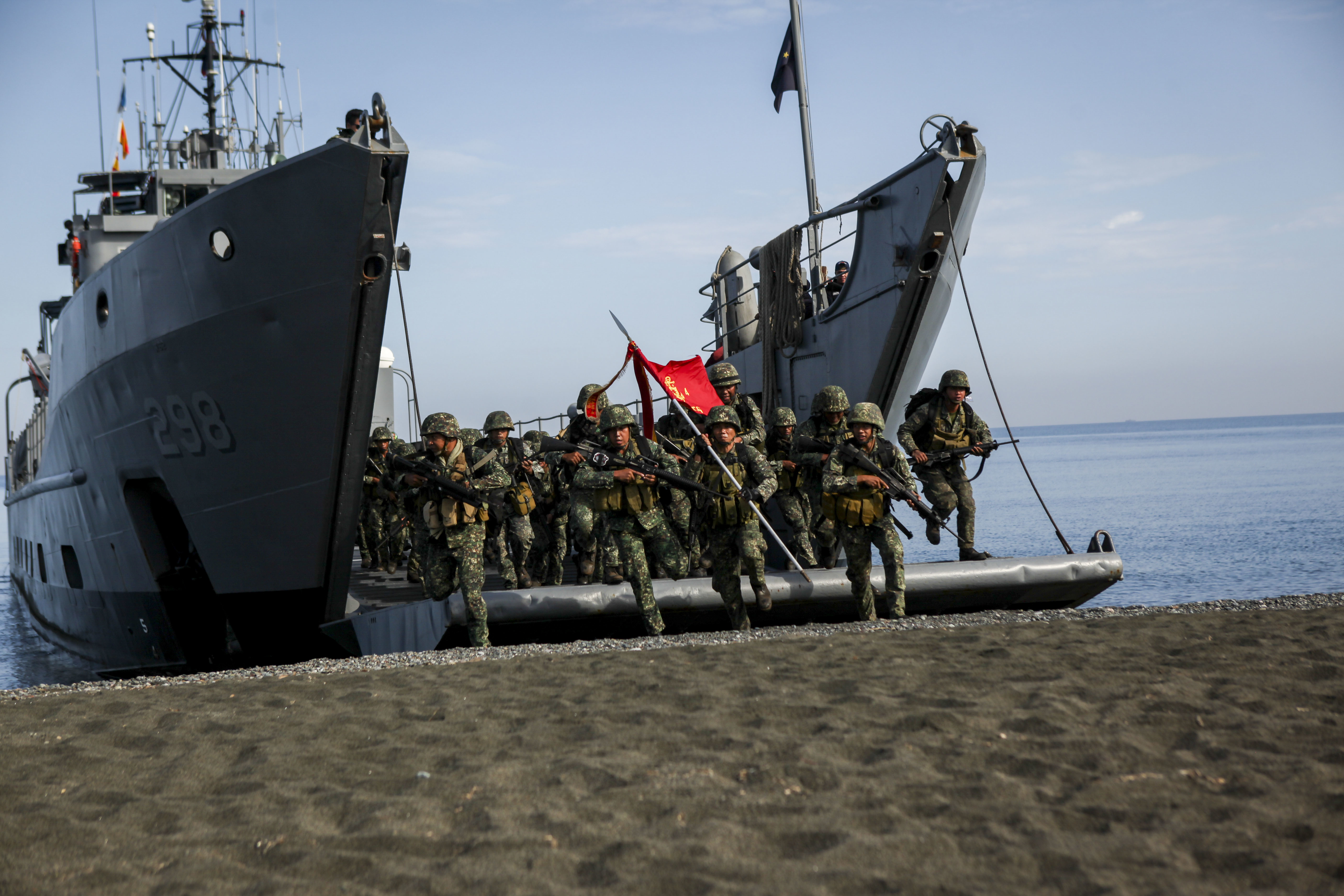Philippine marines with the Joint Rapid Reaction Force (JRRF), conduct an amphibious landing utilizing Philippine logistical navy ships to seize a scenario-based objective as part of Exercise Balikatan 2016. US Marine Corps Photo