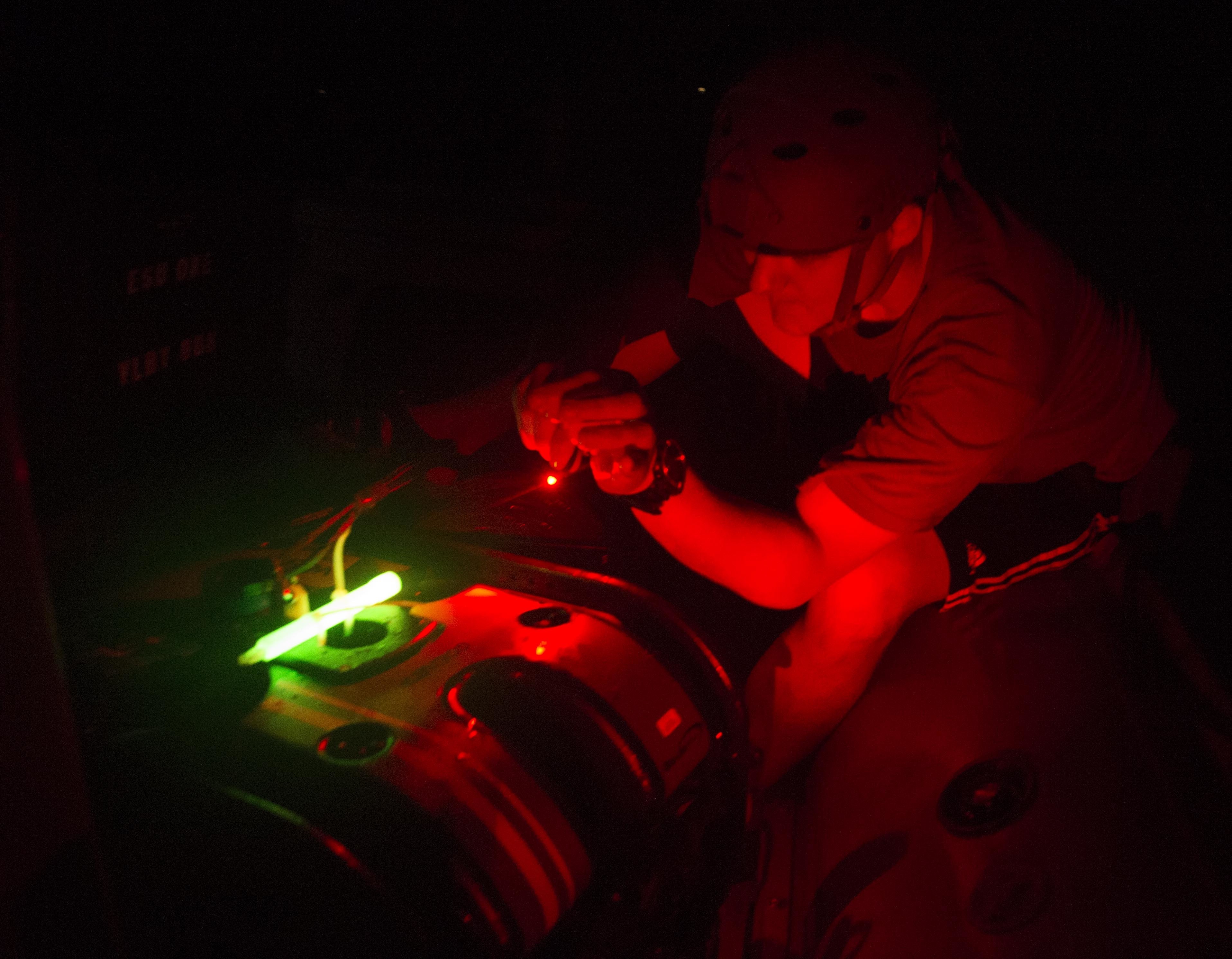 Mineman 3rd Class Brandon Workman, attached to Commander, Task Group 56.1, inspects the Seabotix robot after recovering it from a night dive during the International Mine Countermeasure Exercise (IMCMEX) 16 on April 13, 2016. US Navy Photo