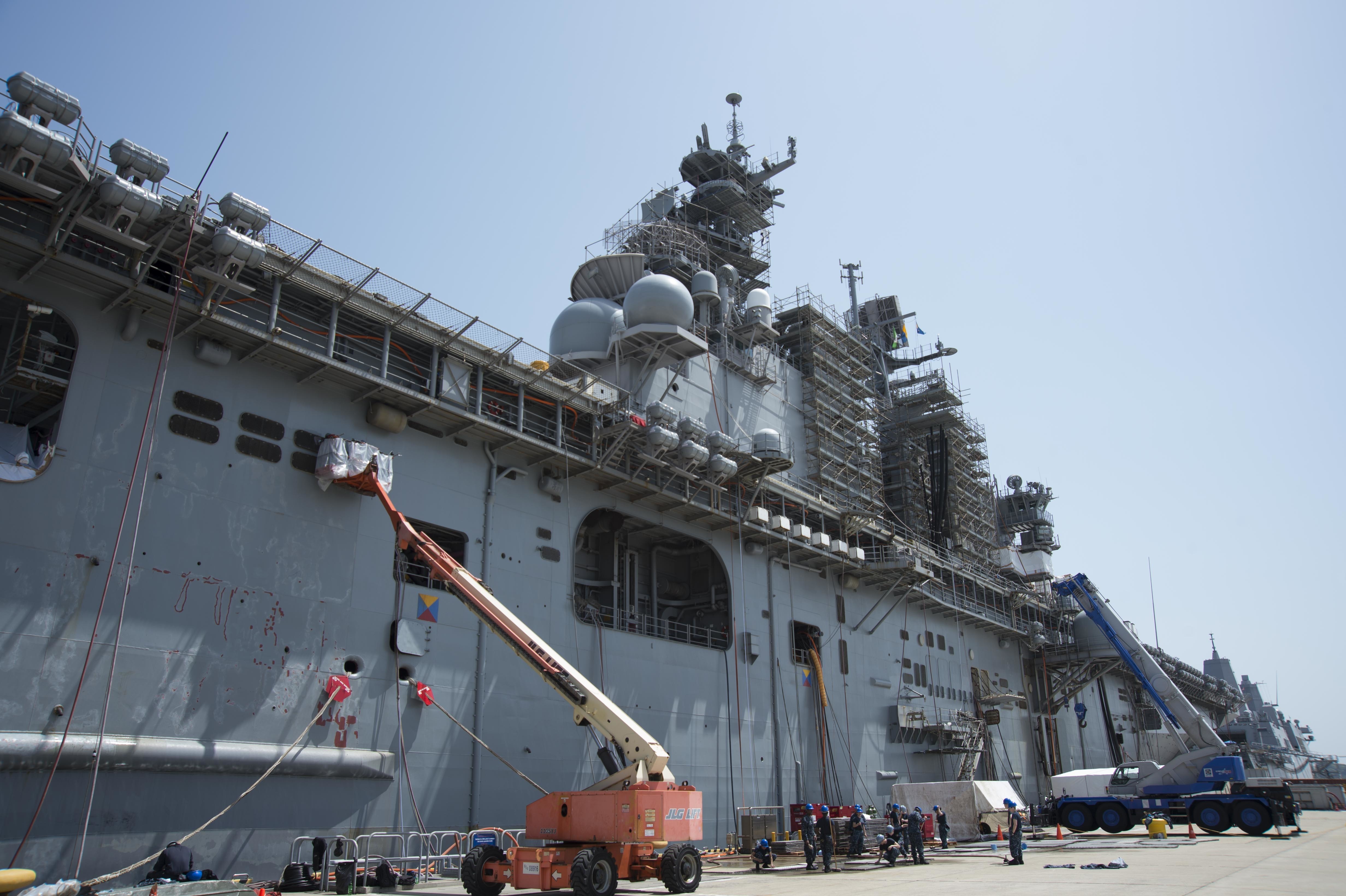Sailors assigned to amphibious assault ship USS Bonhomme Richard (LHD 6) conduct maintenance during a ship's restricted availability (SRA) period in Sasebo on April 14, 2016. US Navy photo.