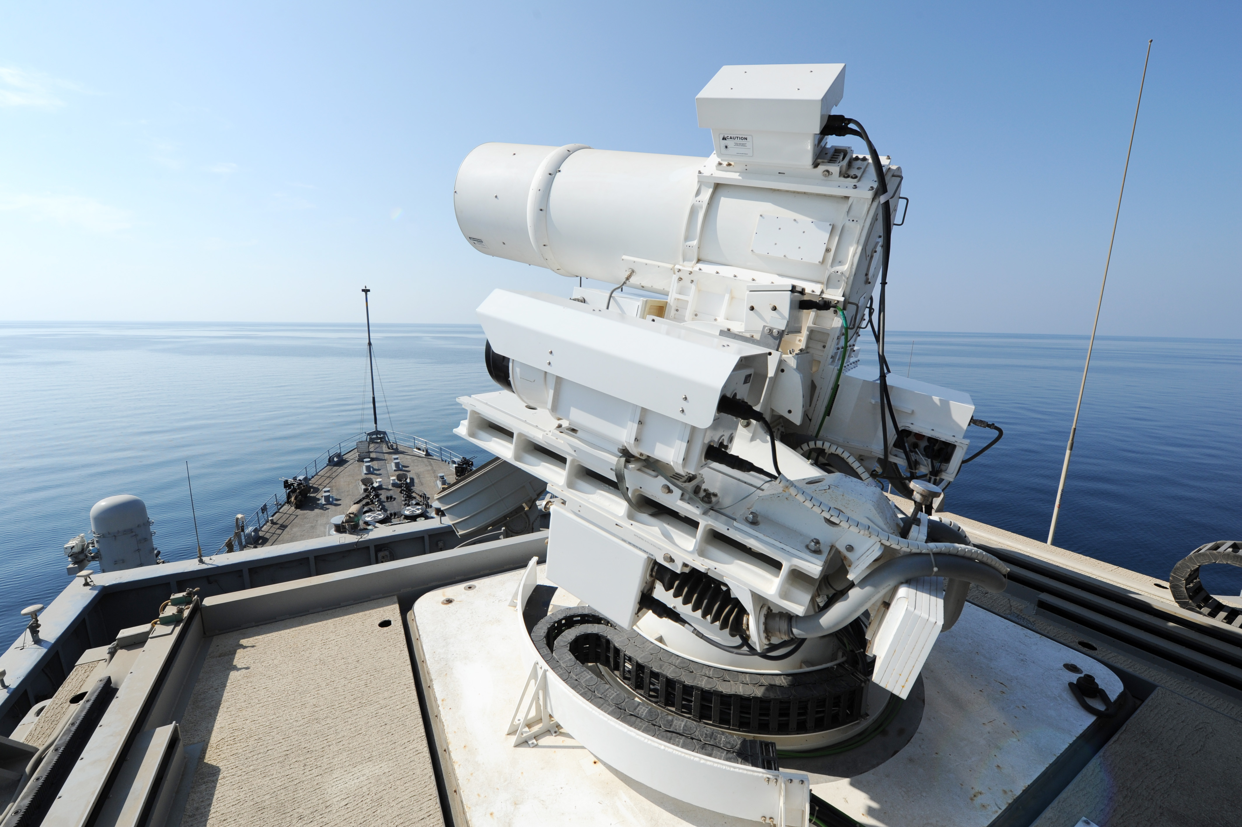 The Afloat Forward Staging Base (Interim) USS Ponce (ASB(I) 15) conducts an operational demonstration of the Office of Naval Research (ONR)-sponsored Laser Weapon System (LaWS) while deployed to the Arabian Gulf on November 17, 2014. US Navy photo.
