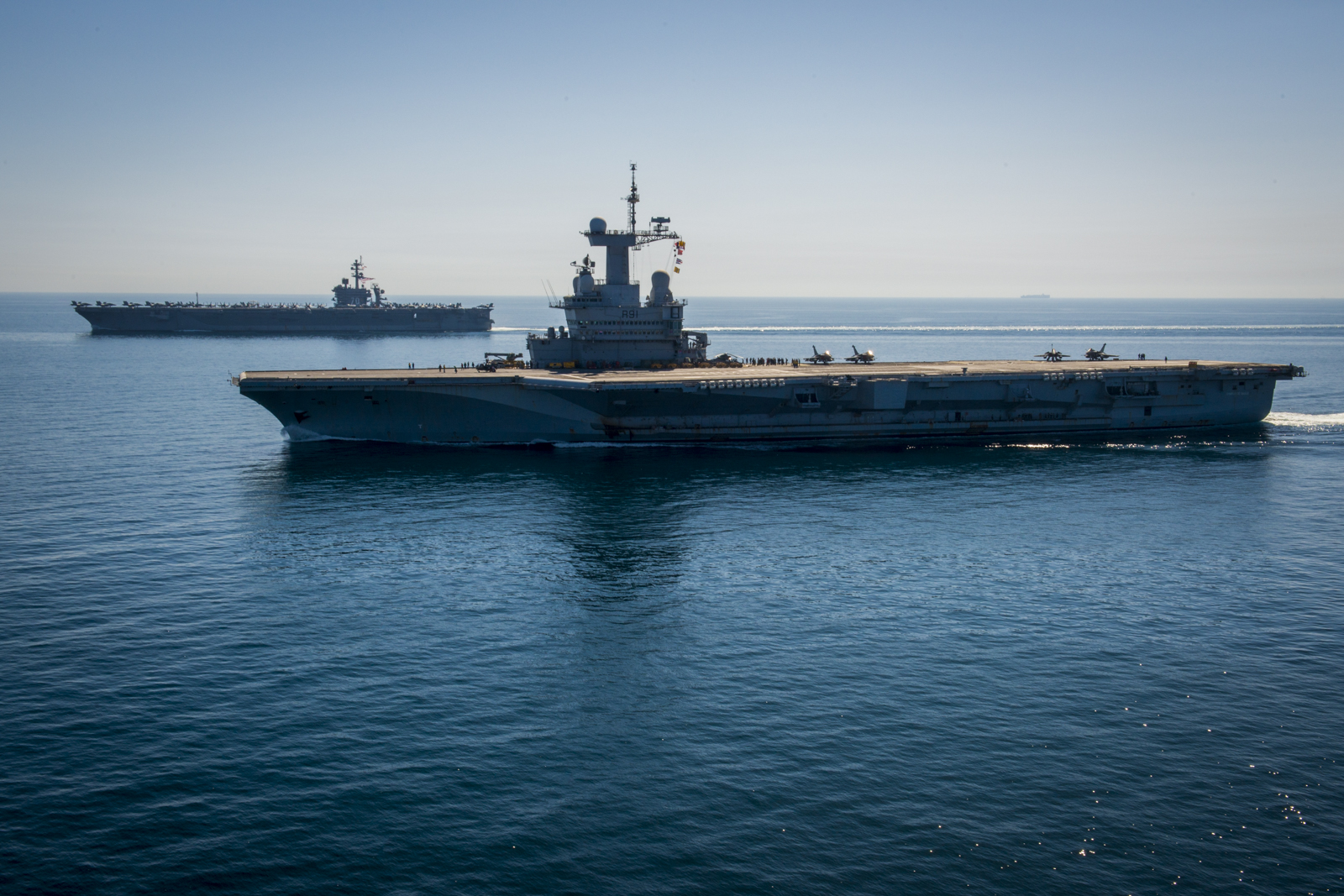 The aircraft carrier USS Carl Vinson (CVN-70), left, and the French nuclear aircraft carrier Charles de Gaulle (R91) transit the Northern Arabian Gulf on March 8, 2015. US Navy photo.