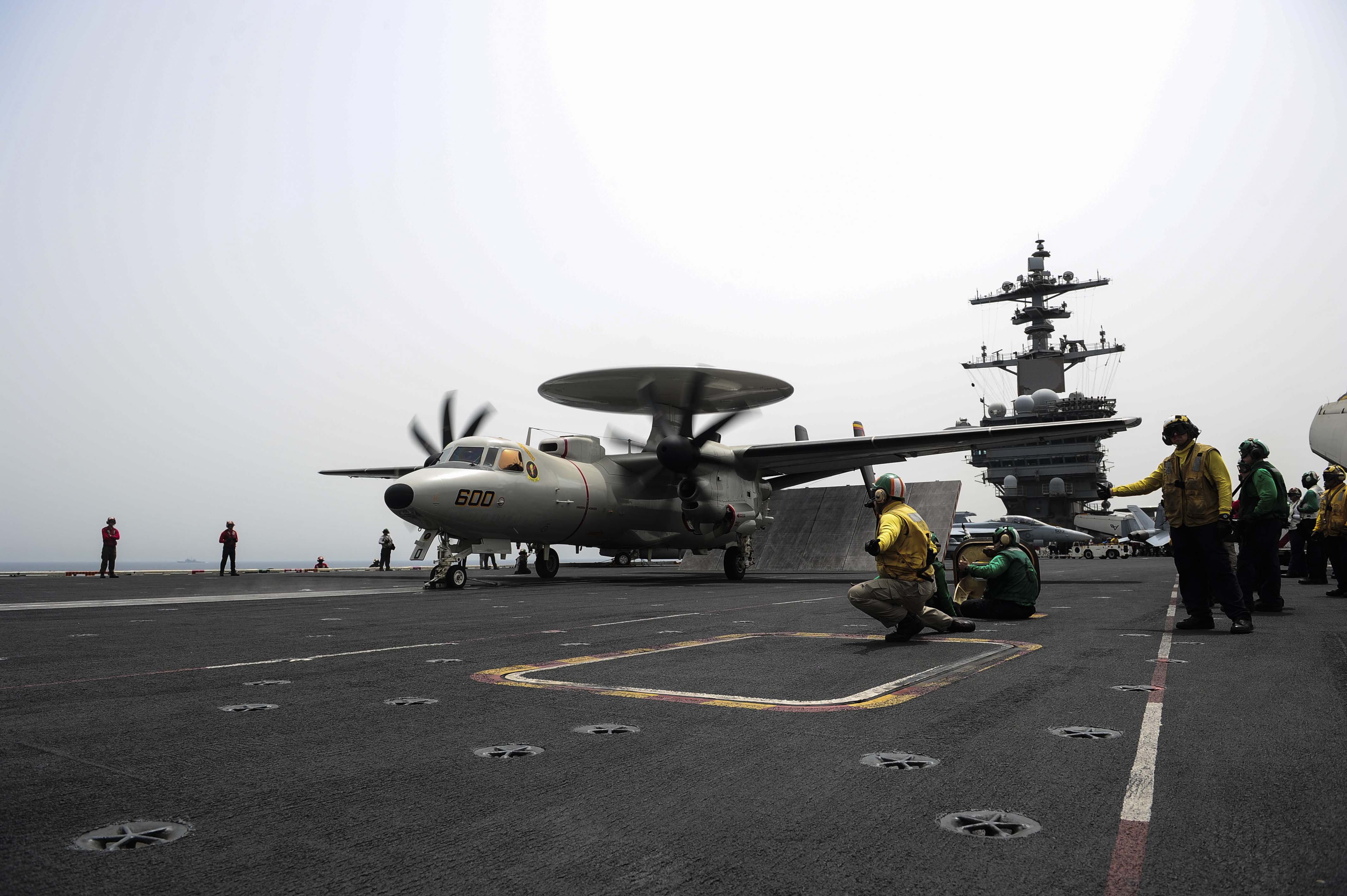 An E-2D Hawkeye, assigned to the Tigertails of the Carrier Airborne Early Warning Squadron (VAW) 125, prepares to launch from the flight deck of the aircraft carrier USS Theodore Roosevelt (CVN 71) on April 28, 2015, while operating in U.S. 5th Fleet area of operations. US Navy photo.