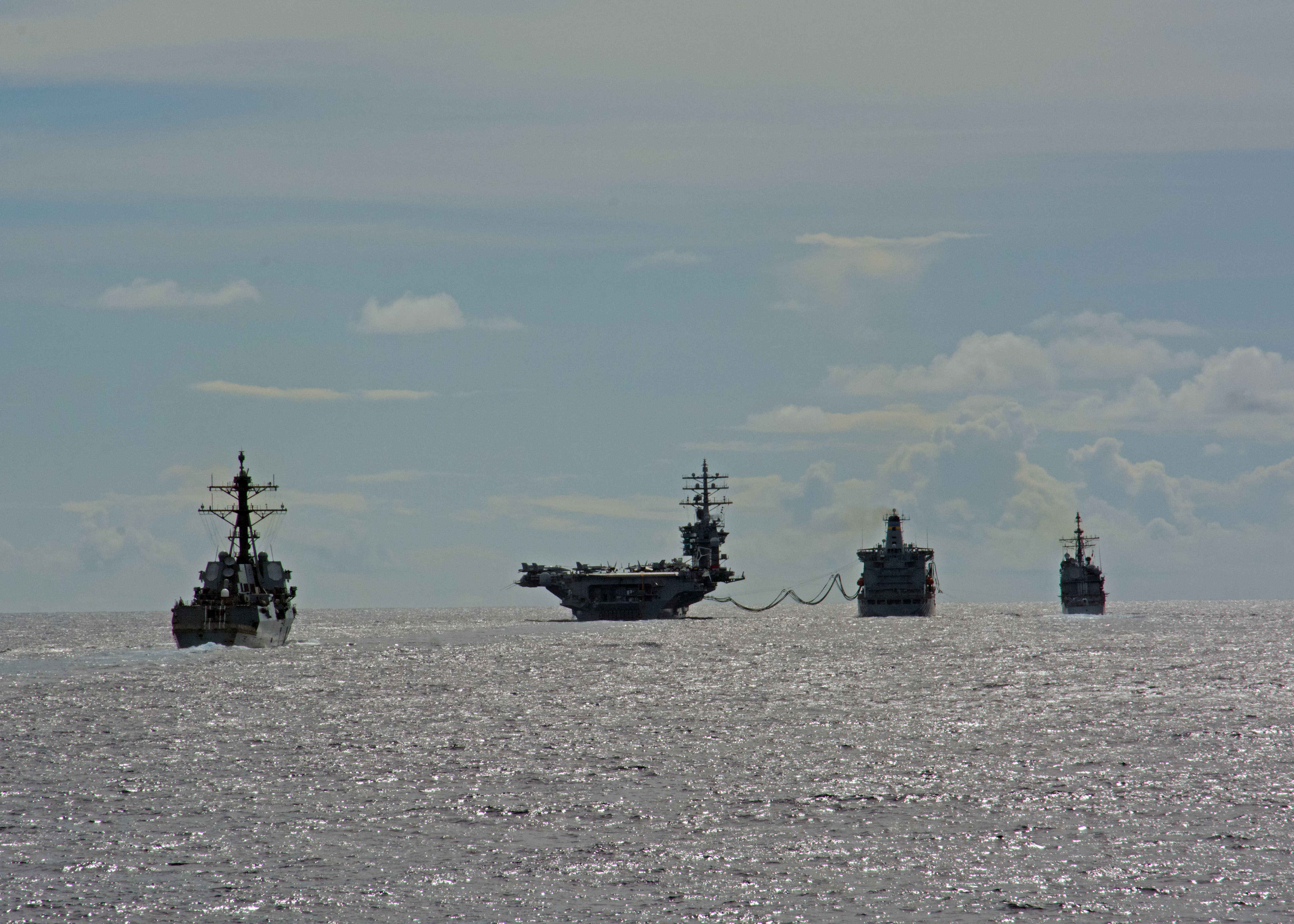 Ships assigned to the Eisenhower Carrier Strike Group (Ike CSG) conduct a replenishment-at-sea with the Military Sealift Command fleet replenishment oiler USNS Big Horn (T-AO 198) on June 2, 2016. US Navy photo.