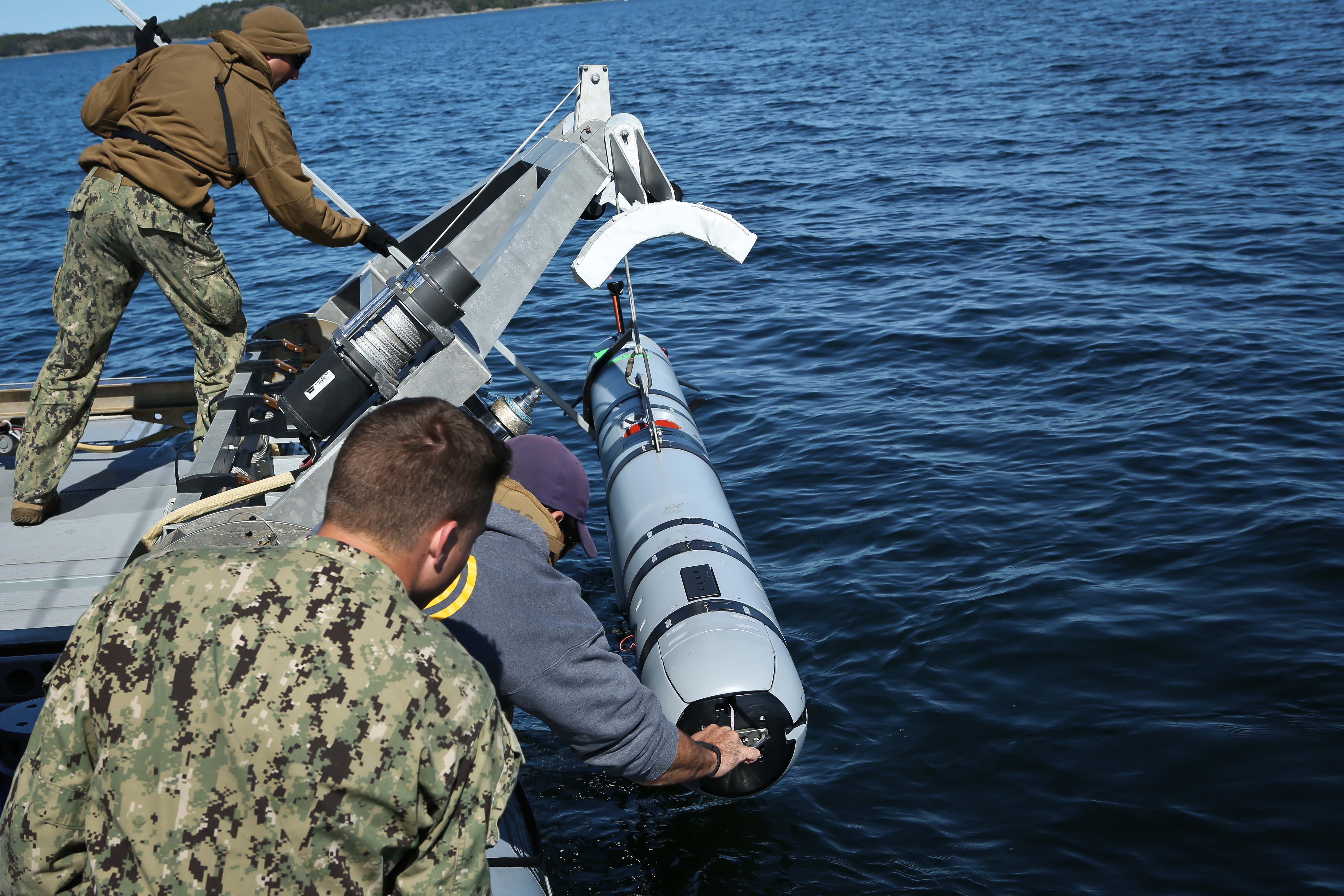 Sailors attached to Mobile Diving and Salvage Unit Two in Little Creek, Va., prepare to insert an unmanned underwater vehicle (UUV) into the Baltic Sea to search for underwater mines during BALTOPS 2016. US Navy photo.