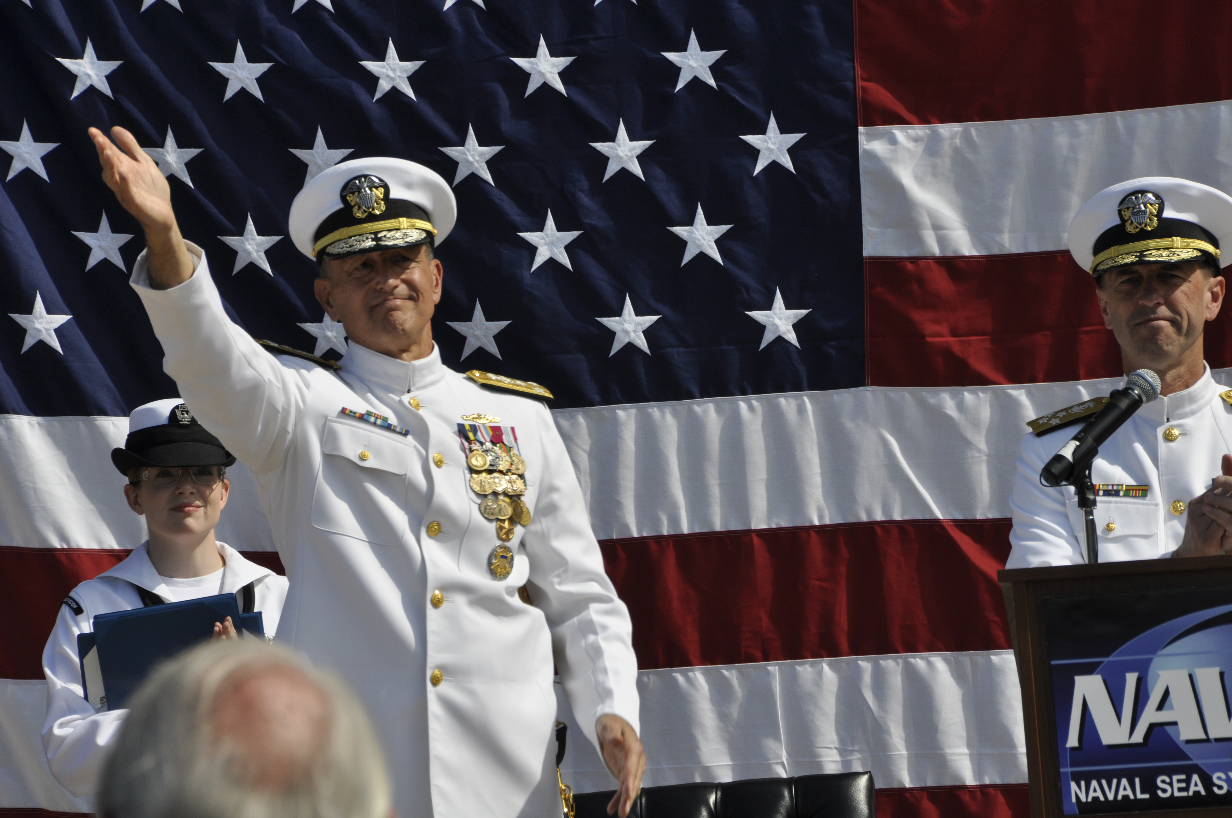 Vice Adm. William Hilarides, outgoing commander of Naval Sea Systems Command (NAVSEA), waves to the crowd during a change of command ceremony today at the Washington Navy Yard. Hilarides retired from the Navy after 39 years of service. US Navy photo.